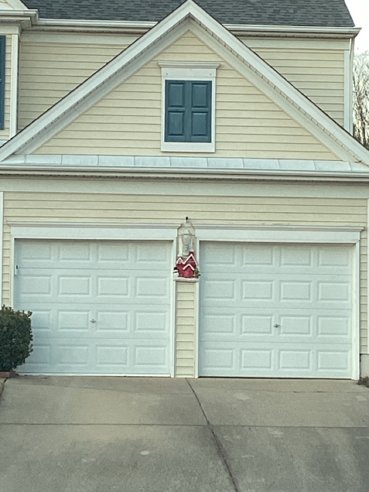 Serviced two single one car, metal garage doors