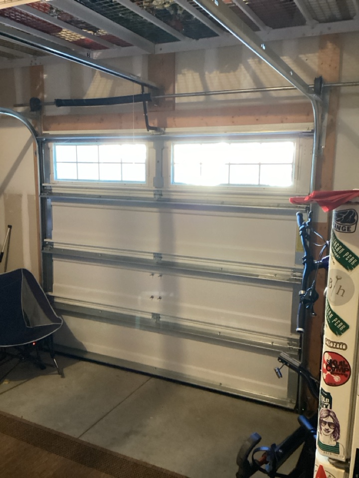 Converted spring system on a single one car weigh Dalton garage door.