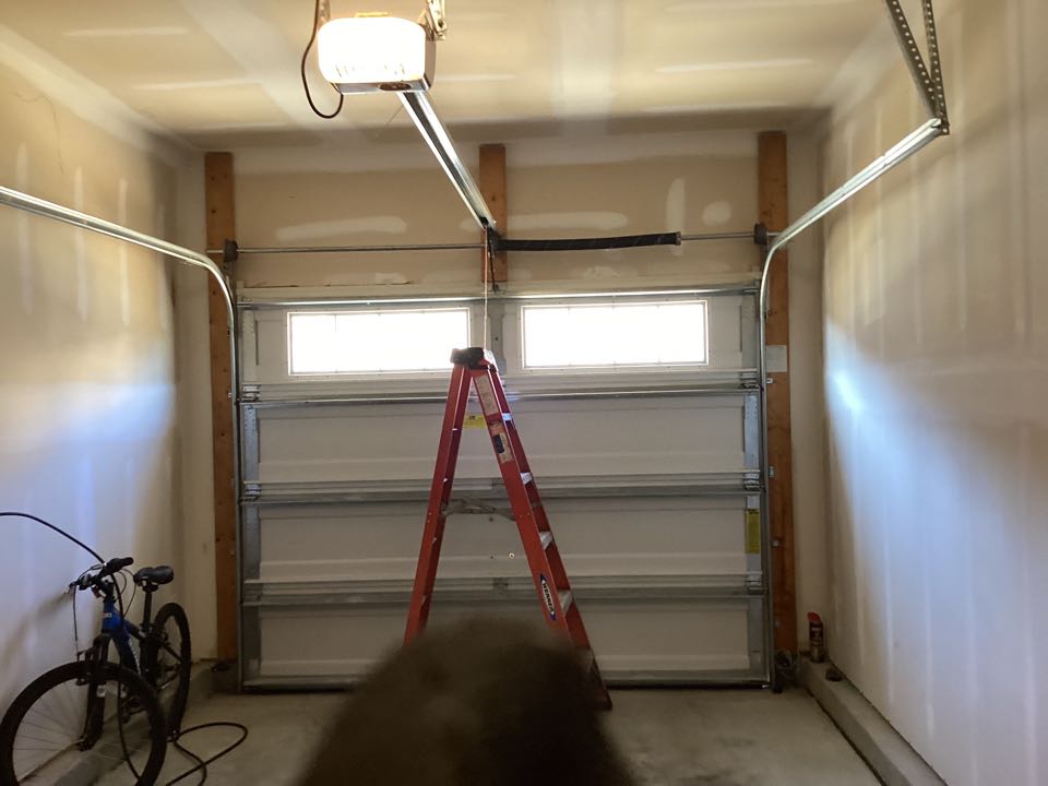 Replaced a torque master spring system with a torsion spring system on a single one car Wayne Dalton garage.