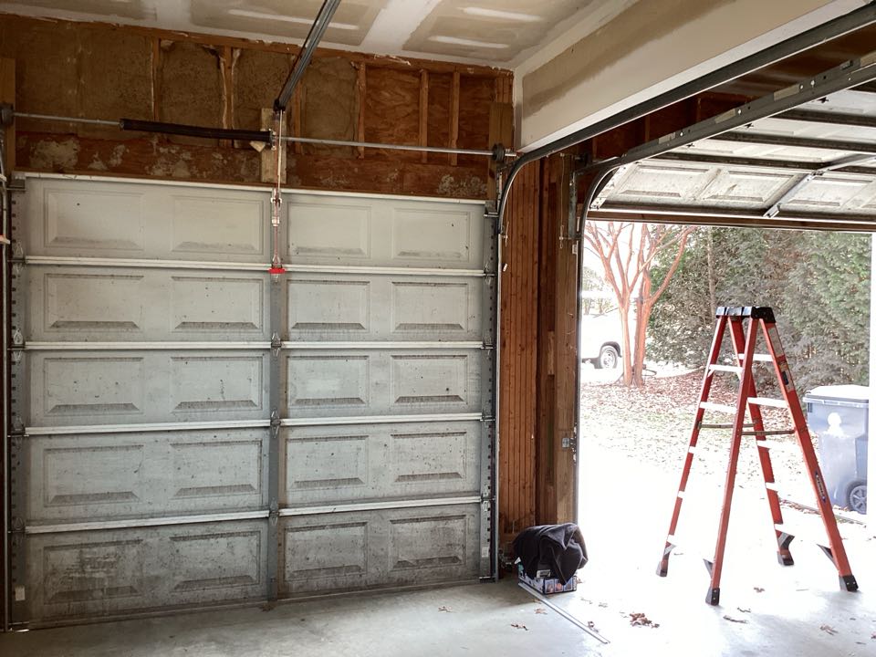 Service/tuned up two single one car, metal garage doors.