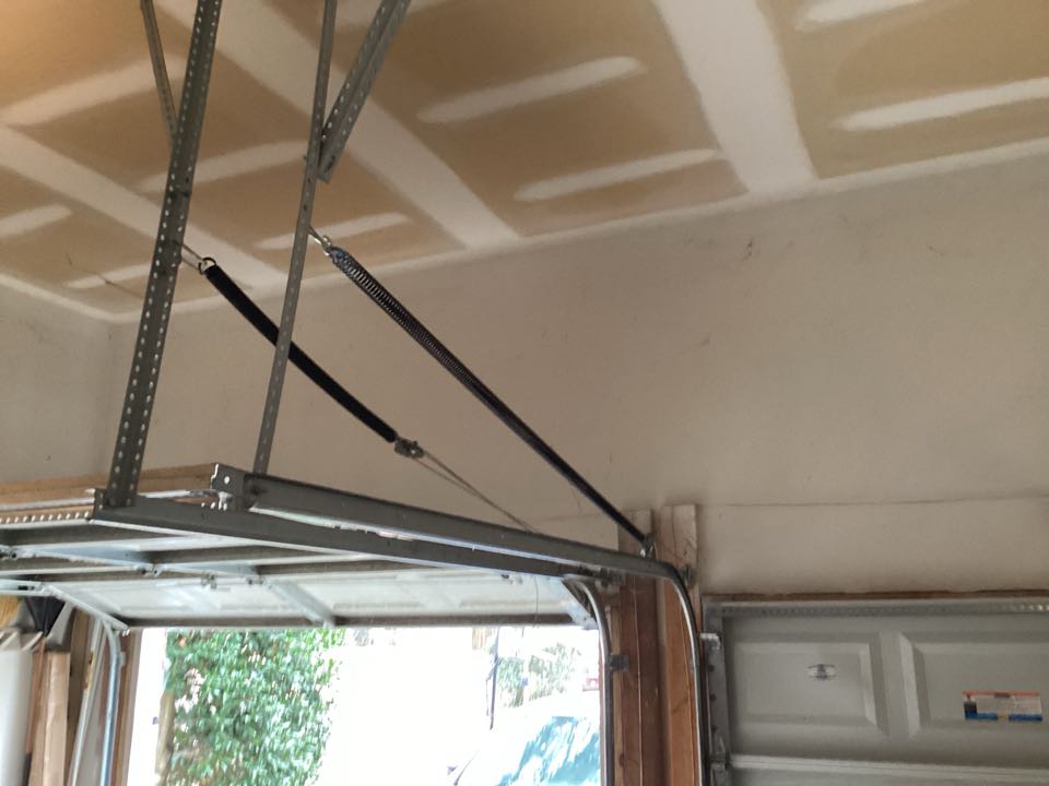 Replaced the pair of extension springs on the right single door.