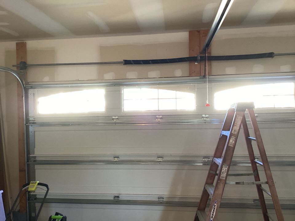 Replace the Wayne Dalton torque master spring system with a torsion spring system for the single two car Wayne Dalton garage door.