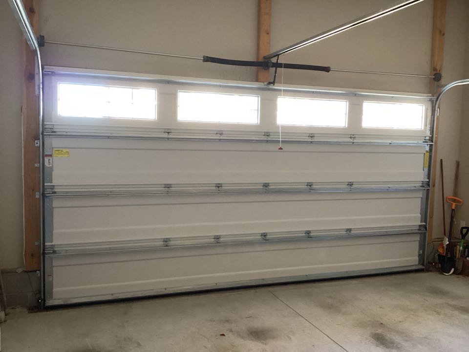 A single two car Wayne Dalton garage door needed serviced and adjustments to garage  door and operator.