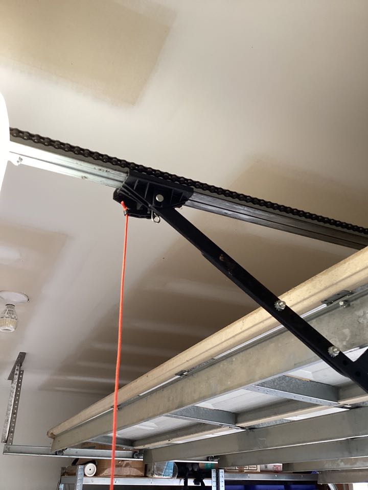 Needed service for a single two car metal garage door and had to adjust the motor arm bracket on a linear garage door operator.