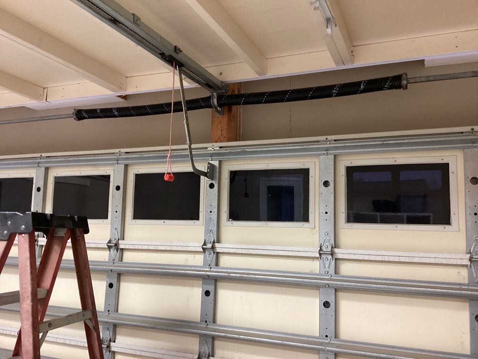 Replaced broken torsion springs on a single two car insulated garage door.