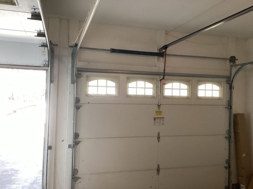 Replaced a broken torsion spring that broke on a single one car insulated garage door.