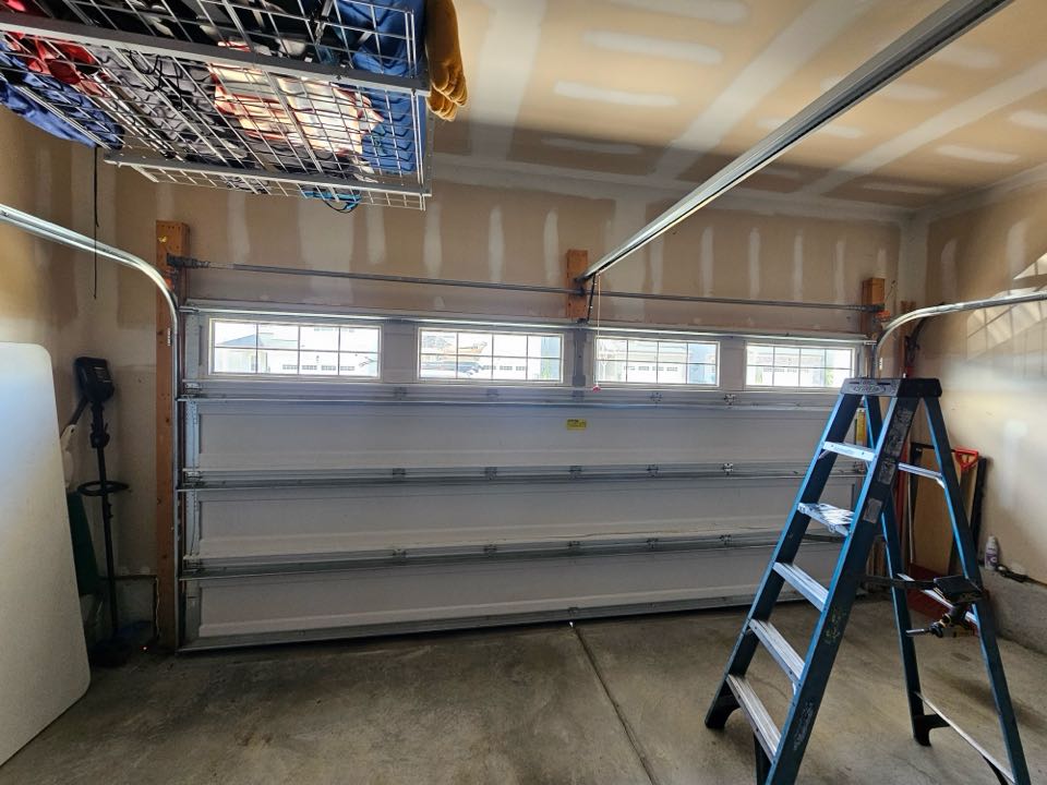 A torsion spring conversion was successfully completed on a Wayne Dalton garage door. The process began with a thorough inspection of the existing garage door system to identify the need for a torsion spring upgrade. The old springs were carefully removed, ensuring safety and minimizing damage to the surrounding components. New, high-quality torsion springs were installed, selected for their durability and compatibility with the Wayne Dalton model. The springs were tensioned to the manufacturer's specifications, ensuring optimal performance and longevity. The garage door was then tested for smooth operation, quiet function, and proper balance. Finally, safety checks were conducted to confirm that the door met all necessary standards. The conversion resulted in a more efficient and reliable garage door system.