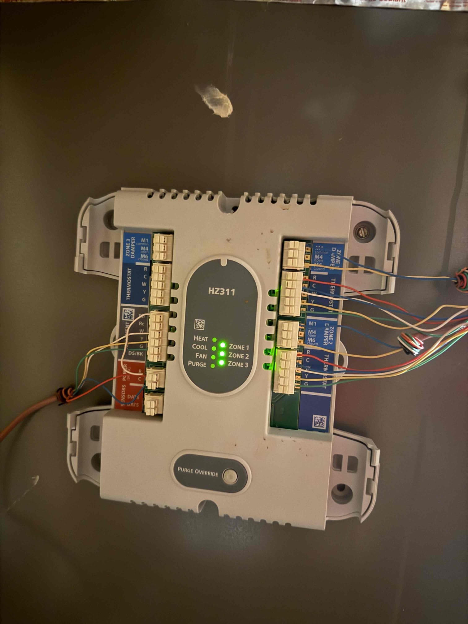 Customer needs a new zone board to be installed to replace the zone board that is not catching the call from the downstairs thermostat.