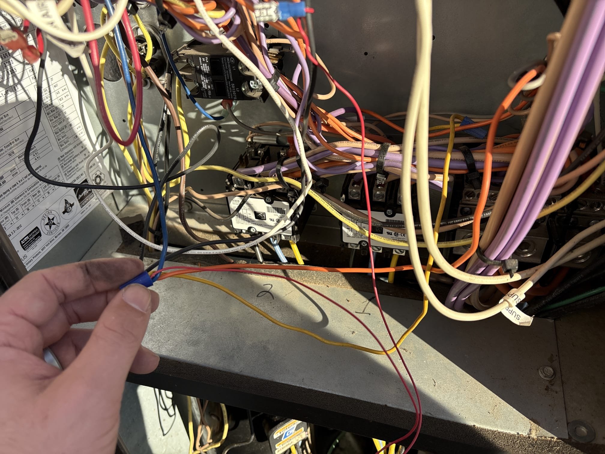 On arrival, I did see that the fire department had turned the units off. I got deep into the diagnostics of these two systems to ensure proper inspection due to the fire department having them off and covering all grounds for safety. The unit that caused the smoke in the building was a burnt baron, and the smoke was coming from the ring after the bearings flew out. The rubber gasket was burning due to friction. Haven’t said that the bearing just can’t be replaced in these units be turned back on. Every safety measure that a factory goes through for equipment has been bypassed on both of these systems. Meaning high limit switches have been bypassed sensors have been tucked and cut. High-pressure low-pressure limit switches have been bypassed. The life of a commercial package is between 18 to 20 years with proper maintenance. System two is currently without function of gas heat. These systems are over 25 years old and have never had maintenance with the appearance and the condition of th