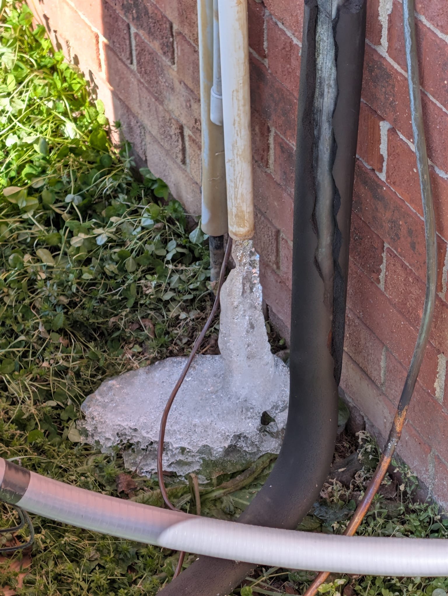 Removed transition that was choking out system. Rebuilt a much bigger plenum to allow the systems to run properly. Found that the drain line was frozen and the condensate for the furnace was installed incorrectly. Rebuilt drain line to drain more efficiently and insulated drain line on the outside of the building. Verified operation in heating mode and emergency heat. System is operational at time of departure.