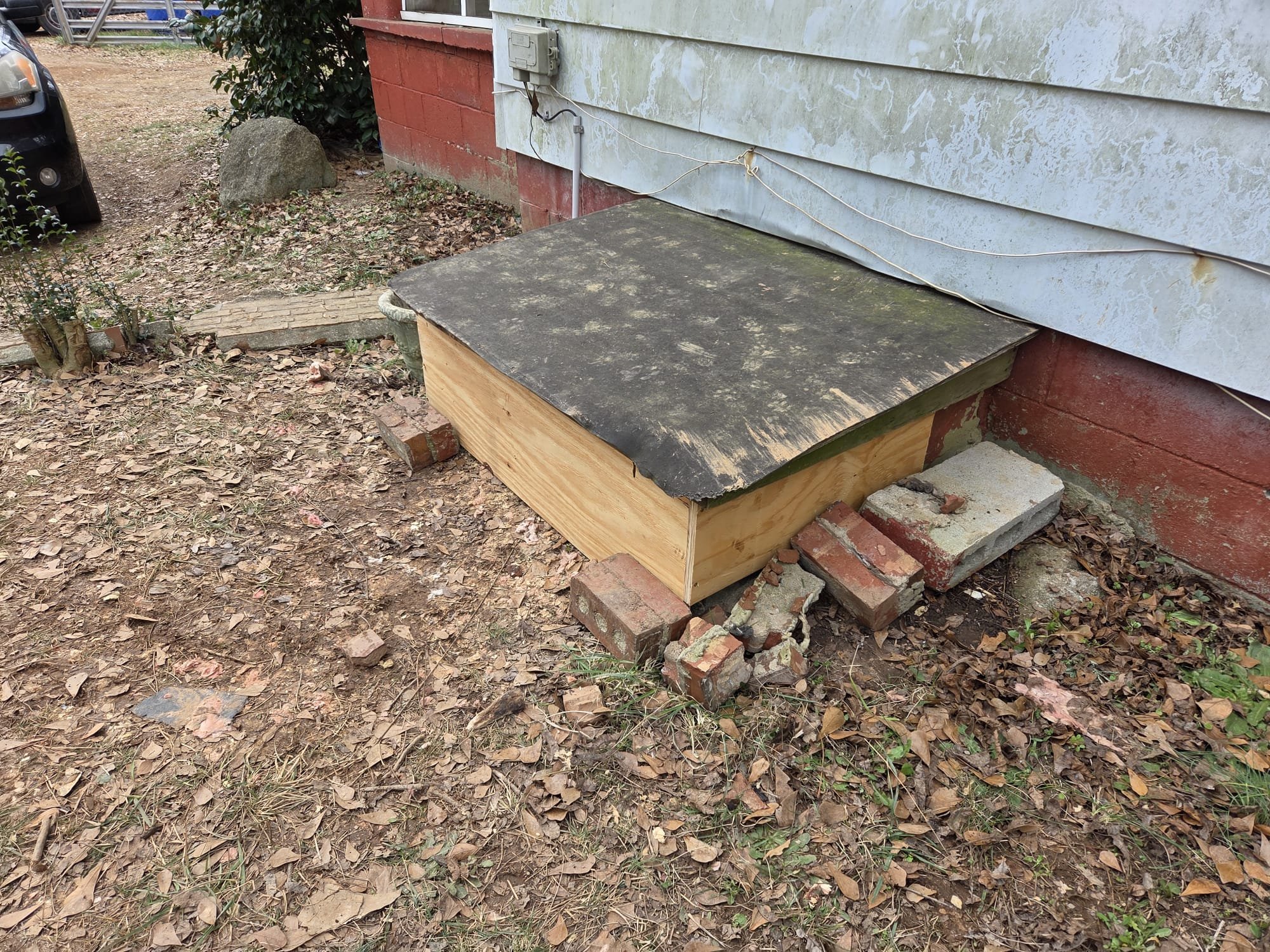 Built a wooden skirt around access to keep animals from getting into crawlspace.