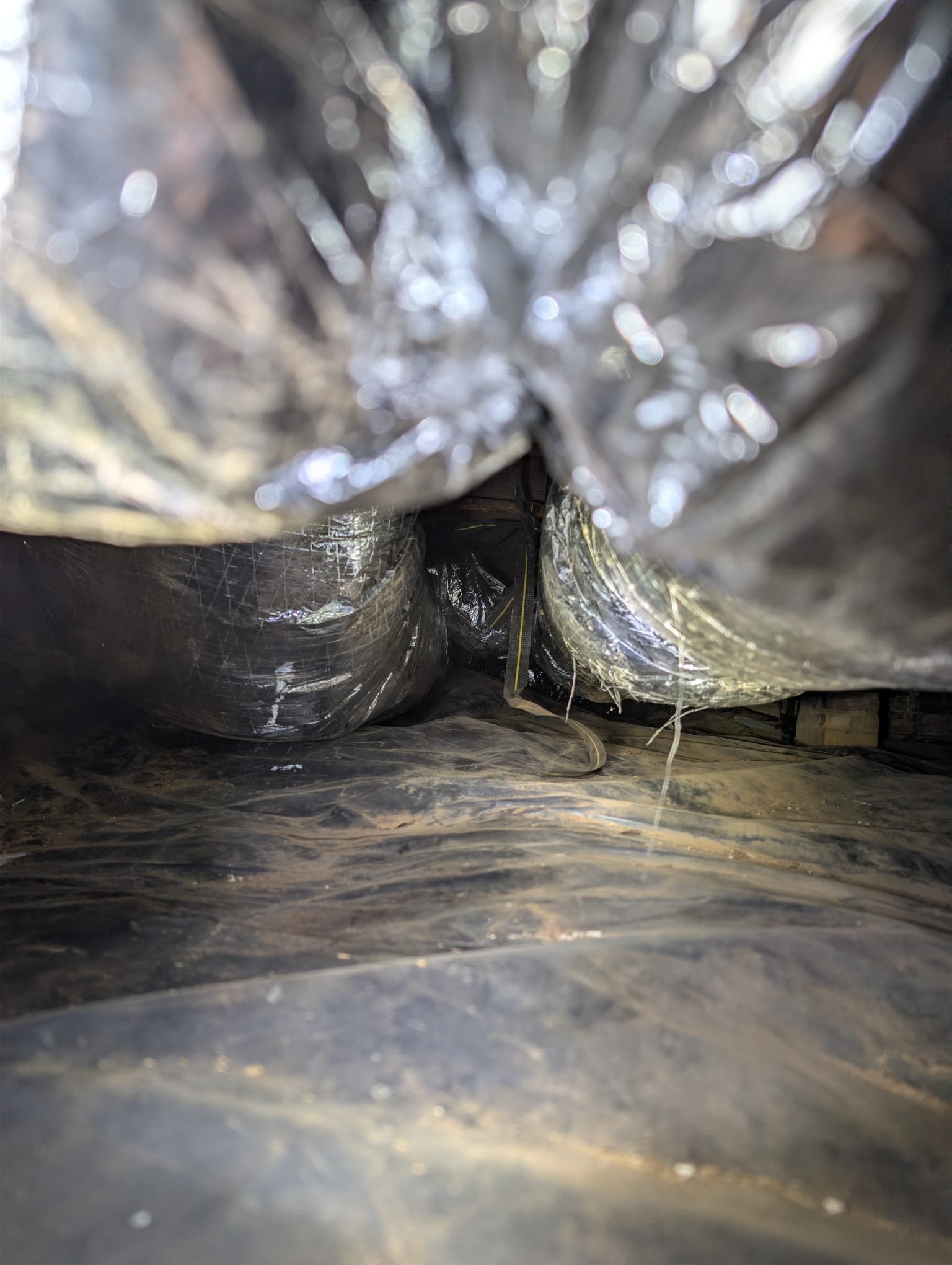 Removed and replaced 2 ton duct system. Installed 15 ft of hard pipe trunkline. Reconnected 6 supply runs. Upsized and replaced return as well return pipe. Replaced square to rounds and resealed flashing to package unit.