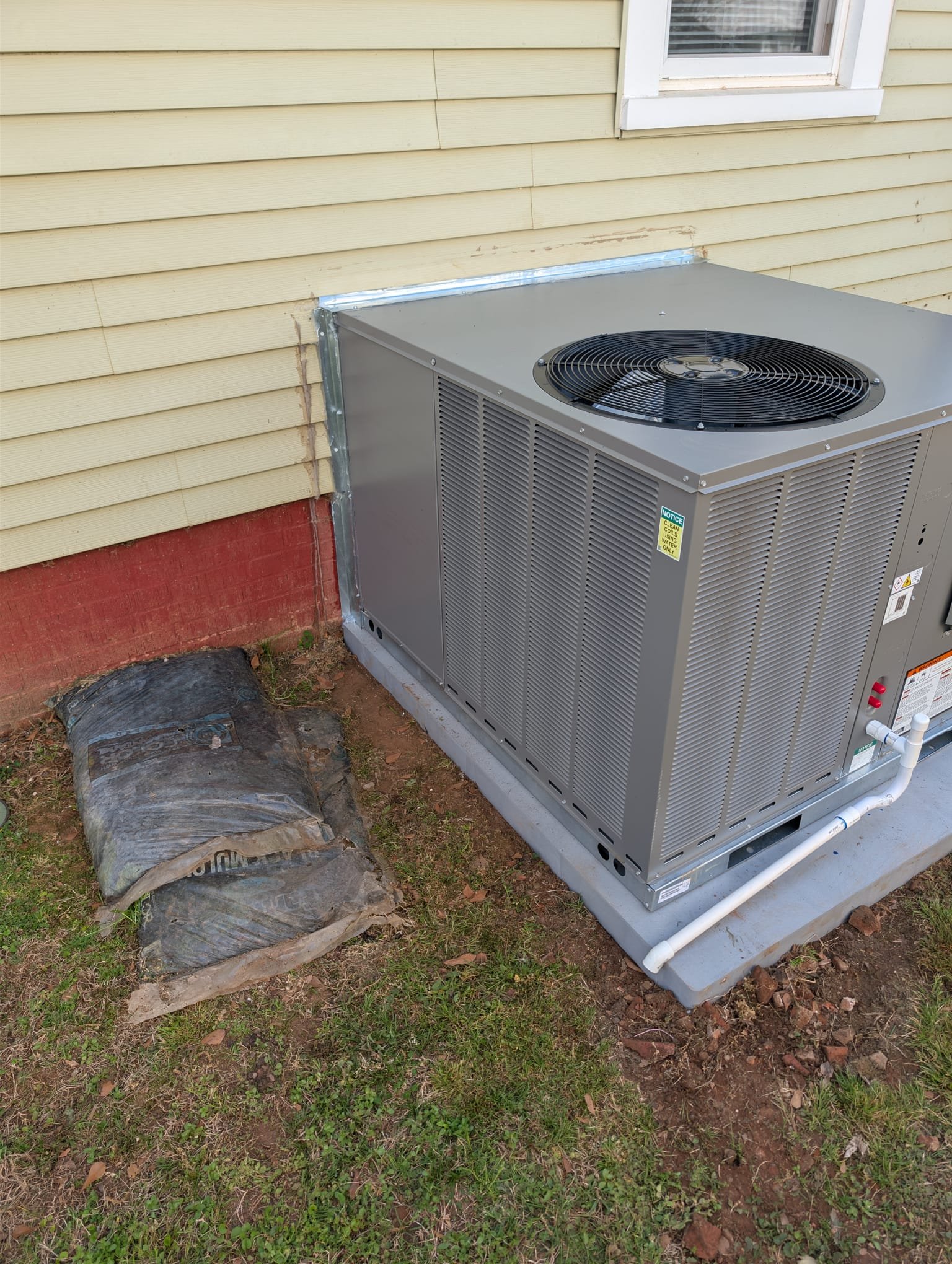 Replaced 2-ton gas package unit. Installed new pad, whip, and thermostat. Reconnected gas line and built new flashing. Verified operation in heating and cooling. System is operational at time of departure.