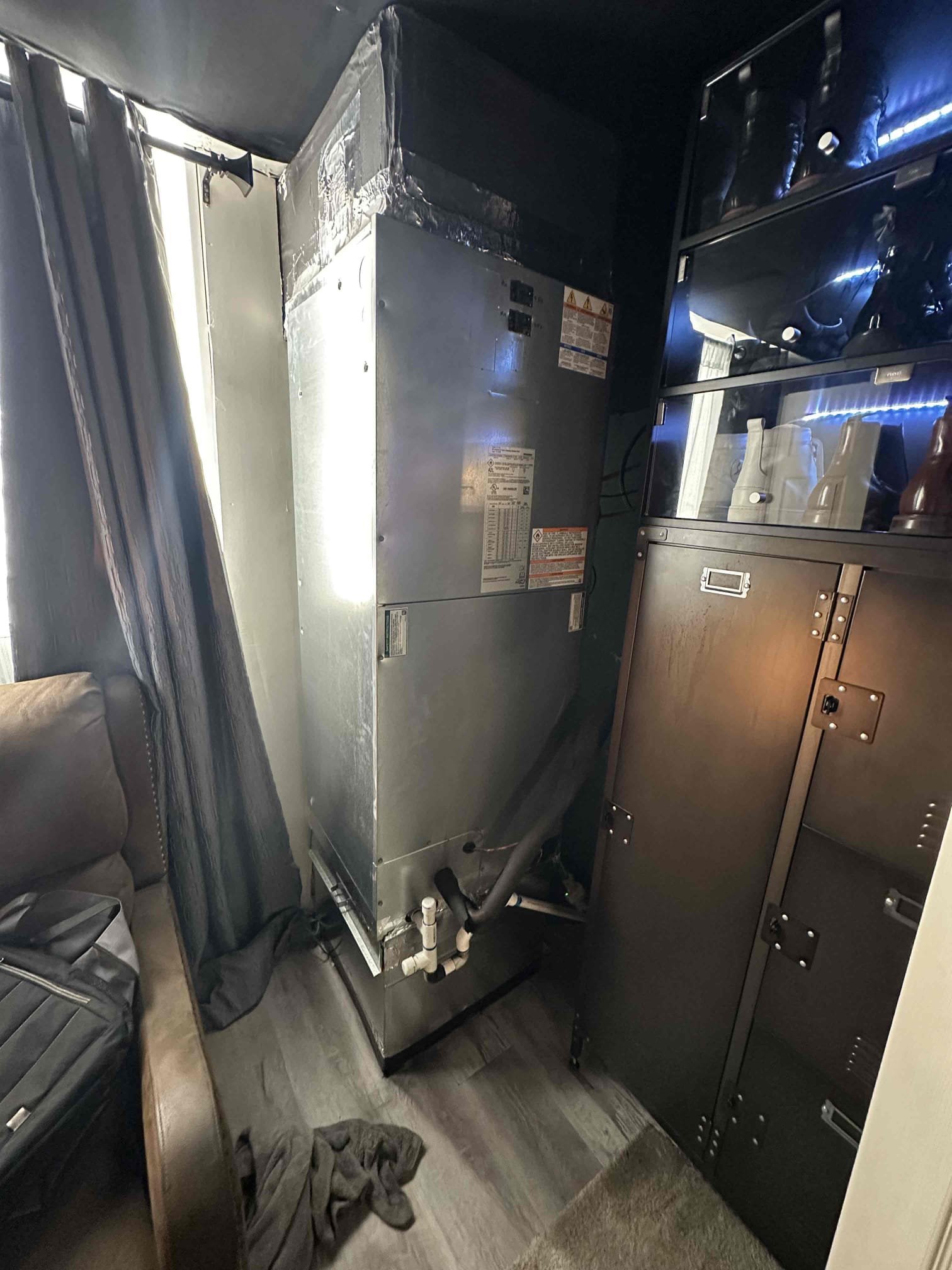 Upon arrival at the job site, a complete inspection of the system was performed. During the evaluation, it was determined that the system is in need of a properly installed auxiliary drain pan beneath the unit due to the finished space located directly below. At this time, there is evidence of water leakage occurring, which poses a risk to the surrounding area.

Further inspection revealed that the existing condensate drain setup is not functioning correctly. The current P-trap and drain line configuration is allowing water to be pulled back into the system, rather than draining properly. As a result, condensate is overflowing the internal pan and contributing to the observed leakage.

It is recommended that we return to reconfigure and properly install the P-trap and drain line to ensure correct drainage and prevent water from being drawn back into the system. Additionally, installing an auxiliary drain pan will provide an added layer of protection against potential water damage in th