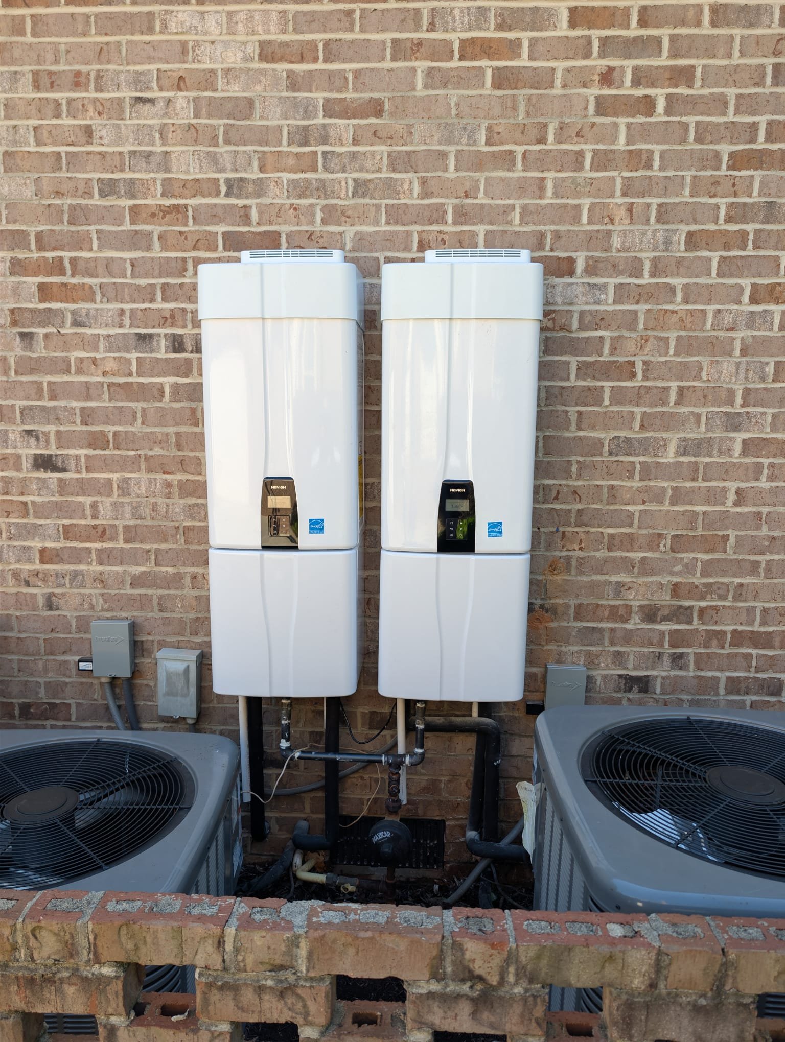 Installed 2 Navian tankless water heaters. Reran water lines and gas pipe. Need to return to install cascade kit and run wire for remote. Units are operational at time of departure.