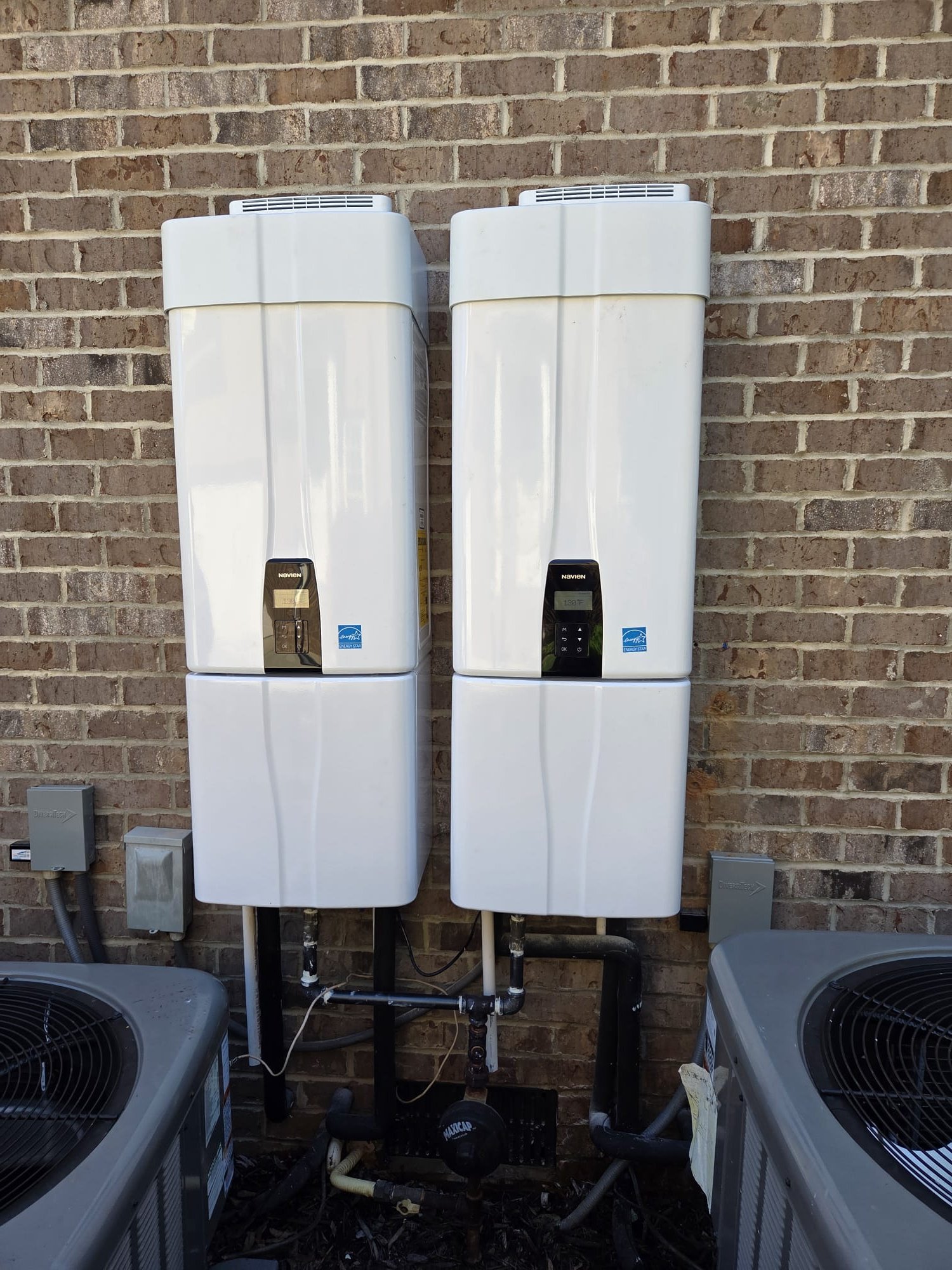 Installed 2 Navian tankless water heaters. Reran water lines and gas pipe. Need to return to install cascade kit and run wire for remote. Units are operational at time of departure.