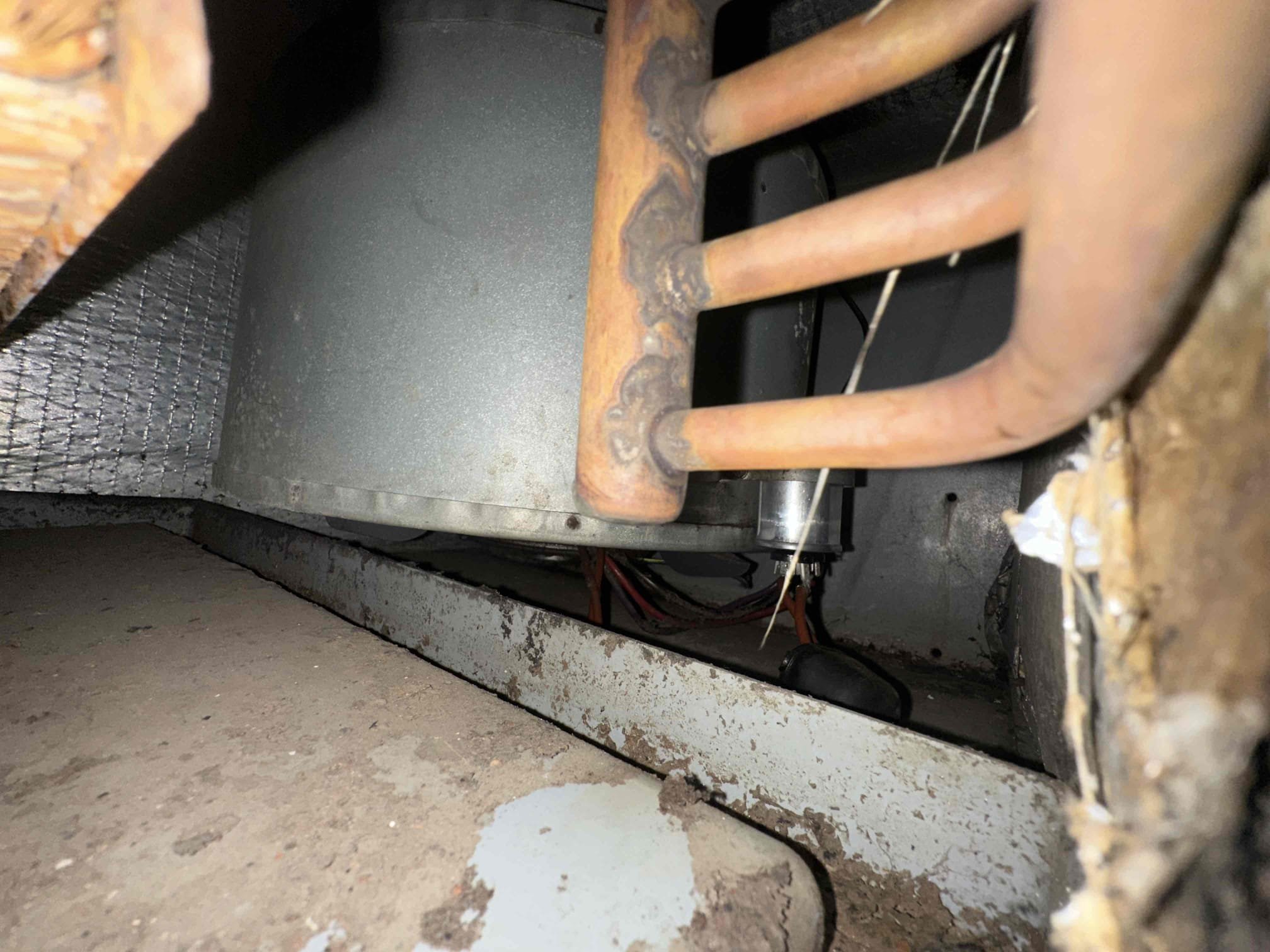 Arrived on site for an AMS warranty service call to evaluate the customer’s HVAC system. Upon inspection, the system was identified as a 24-year-old unit operating on R-22 refrigerant. A full diagnostic evaluation was performed, and it was determined that the system is not operating properly due to low refrigerant levels, indicating a likely leak within the system. Given the age of the equipment and the phased-out status of R-22, repairs involving refrigerant replacement may be costly and temporary in nature.

Further inspection of the air handler revealed that the blower motor assembly is out of balance, which is negatively impacting system performance and airflow. The blower assembly will need to be replaced to restore proper operation and prevent further damage to internal components.

Additionally, a visual inspection of the ductwork showed significant mold growth throughout the duct system. This presents a potential indoor air quality concern and should be addressed promptly. Reco
