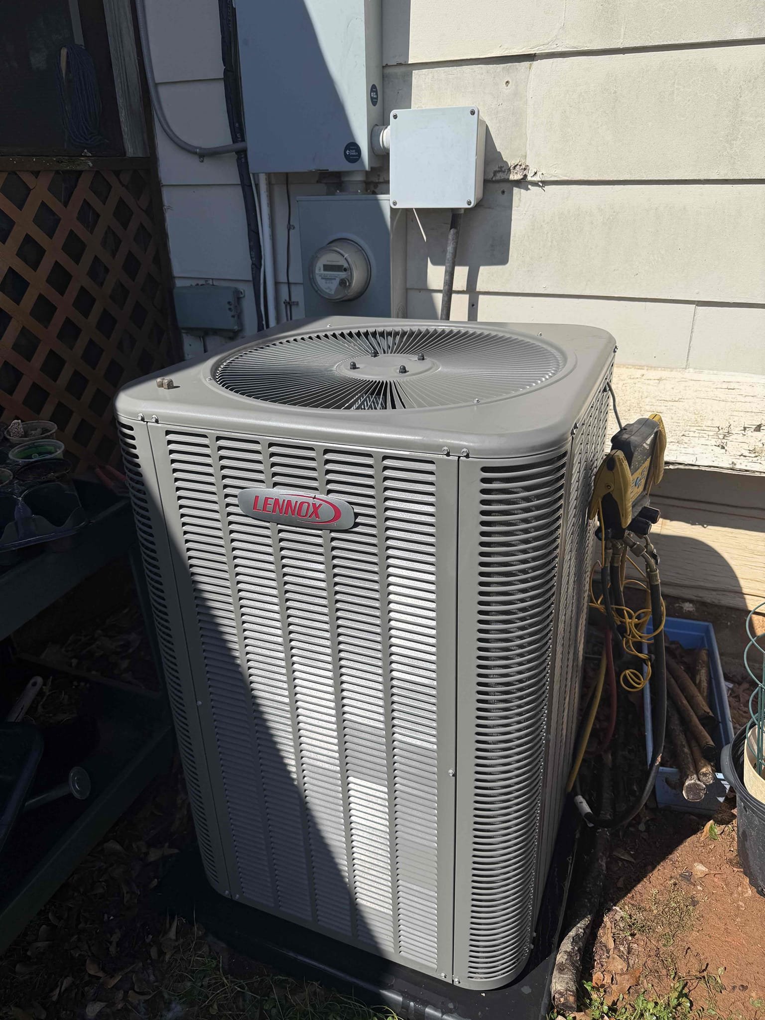 Installation of bacteria growth inhibitor at the evaporator coil inside the air handler in the attic