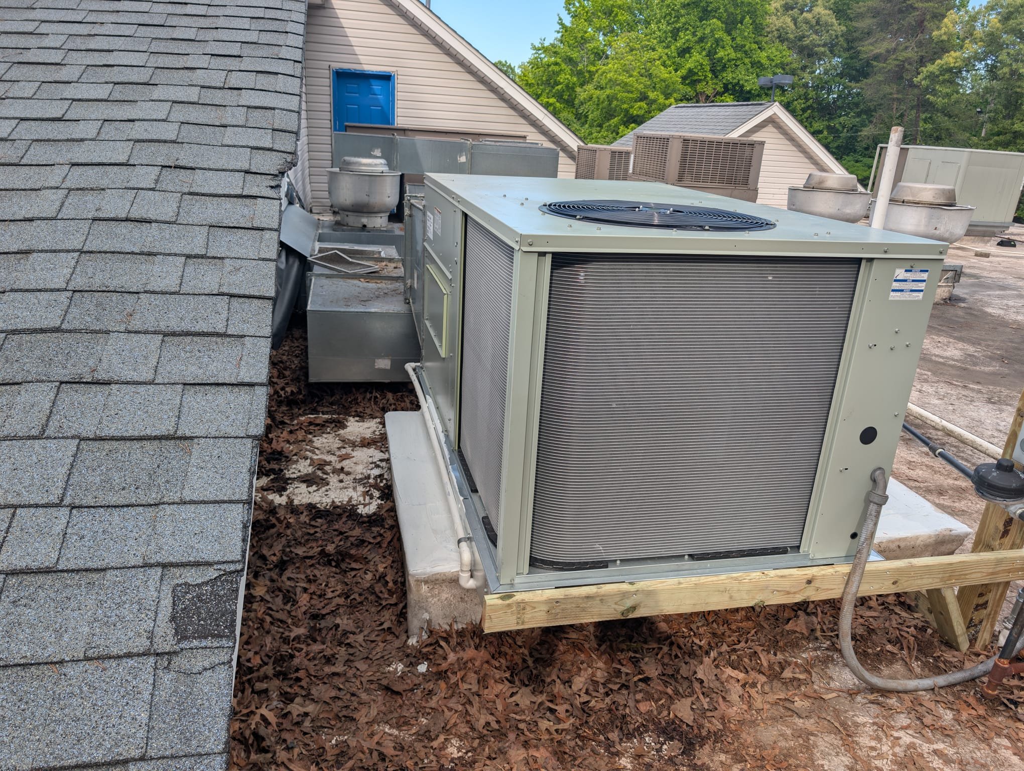 Replaced 10 ton gas package unit with 5 ton gas package unit on roof. Utilized crane. Repositioned unit to reconnect into existing ductwork. Built stand for disconnect. Sealed original curb to prevent rain from leaking into building. Replaced thermostat. Verified operation in cooling mode. System is operational at time of departure.