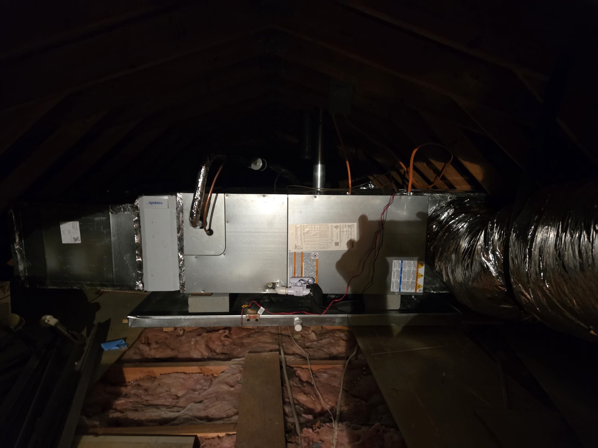 Installed 2 ton heat pump and air handler in the attic. Ran new high voltage to the indoor and outdoor systems. Installed 2 breakers. Ran new thermostat wire from the outdoor unit to the indoor unit and from thermostat to indoor unit. Installed thermostat. Ran new 35 ft of line set from heat pump to air handler. Upsized filter grille to 14x25 with new return box and 14" flex. Installed 2 new plenums. Cut in and installed 9 vents in the ceiling. Installed 30ft of trunk line. Installed new drain pan with new platform for unit to sit on. Ran new drain line from the air handler to the outside. Installed 2 float switches. Installed 16x20x4 aprilaire cabinet. Verified operation in cooling mode. System is operational at time of departure.