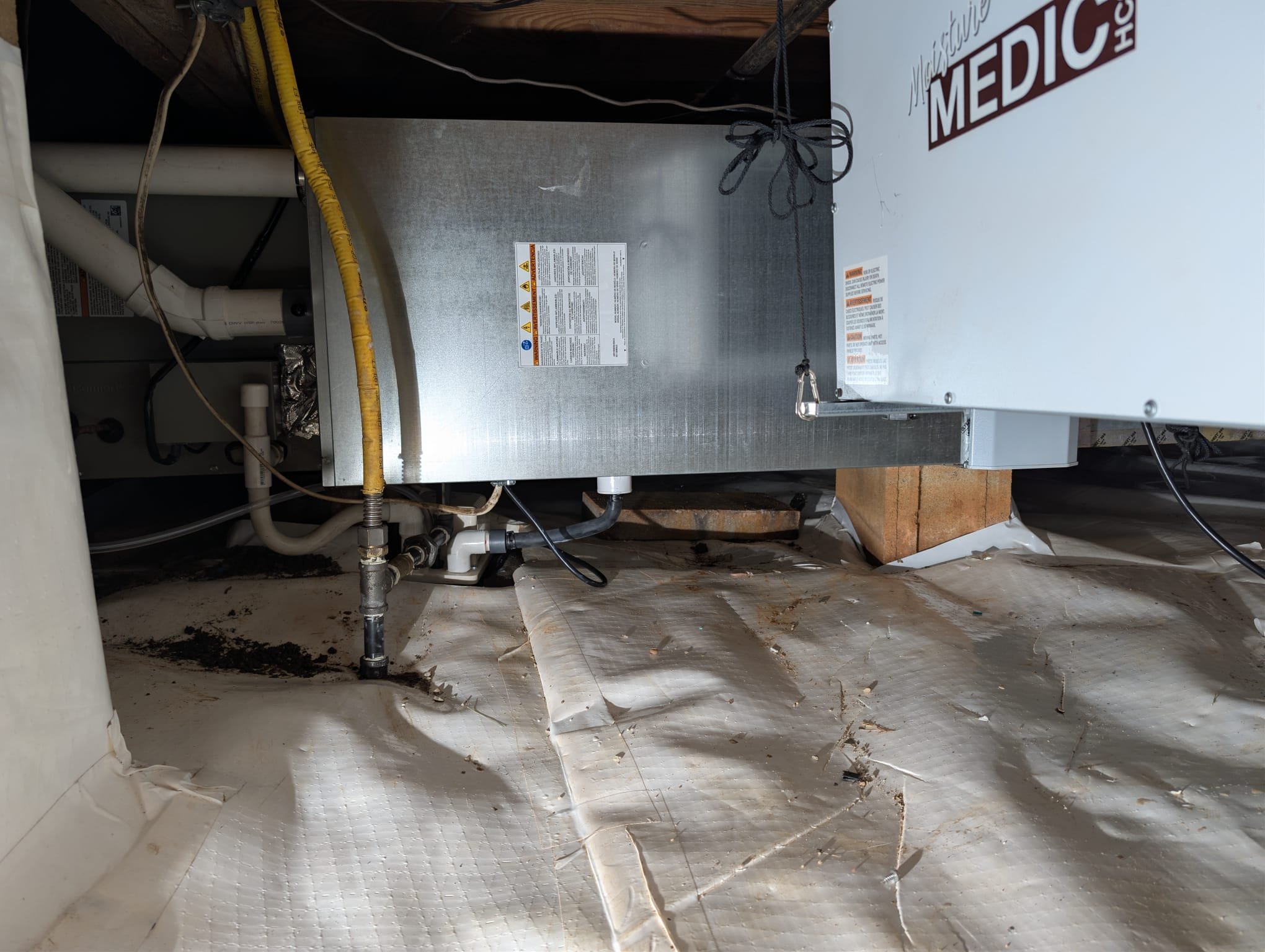 Installation of new 3 Ton straight AC/gas three-piece split system in the crawlspace with advanced filtration 
