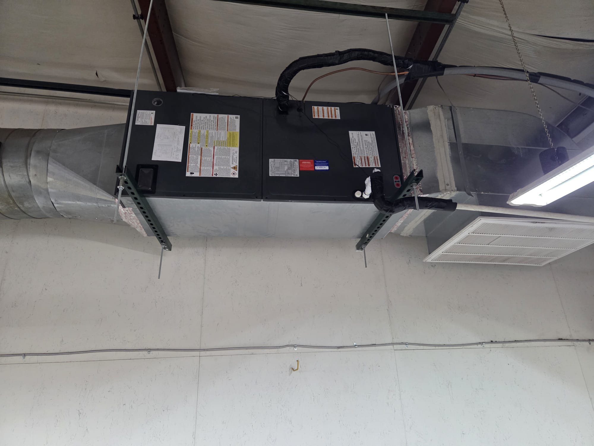 Releveled hanging unit to proper pitch. Removed EZ trap and installed ss1 switch with new p-trap. Adjusted grade on drain coming out of the wall. Verified draining. 
