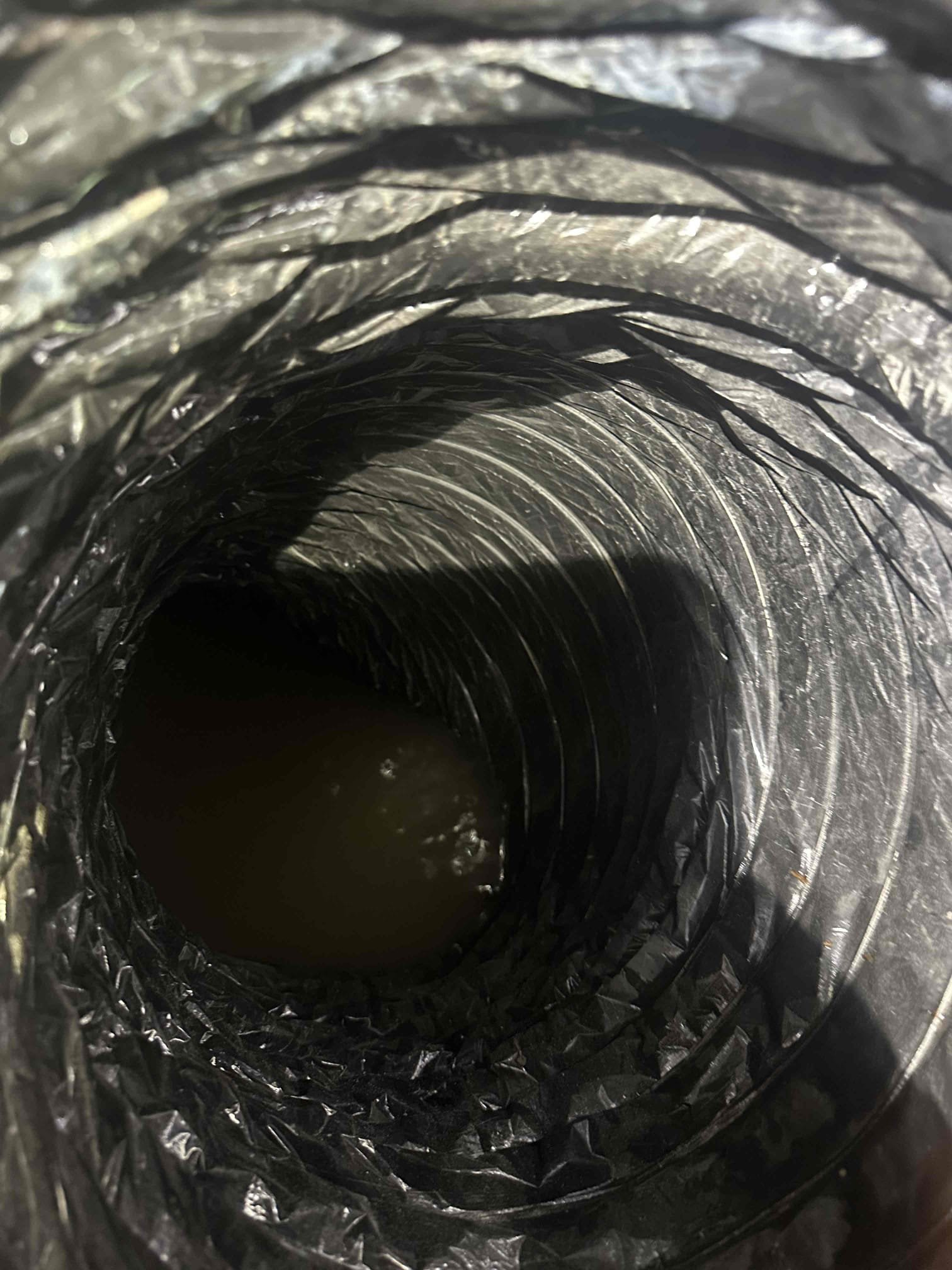 Clogged condensate line on new system, supply duct fell, sub floor wet. Customer is going to shut the system off Monday and allow to dry up, and the installers will come out Friday to attach supply duct. And inspect insulation and floor. Homeowner will leave the crawlspace access unlocked and will come out and meet y’all if needed. Came out and reinstalled supply back to system after emptying. Informed Justin the system is pouring water from the drain pan or drain fitting. Can’t tell which one unable to remove the makeshift return blank. Justin wants the drain line redone, there 12in crossover duct needs to be replaced and something more appealing than seeing two returns. Said if it has to be uninstalled and reinstalled do what it takes. 

Coil had a manufacturer defect and was leaking water into the unit when fan would run. When talking to tech support at yandle it was stated that this is a common issue with mortex coils. Tech support wanted me to seal coil where manufacturing had mis