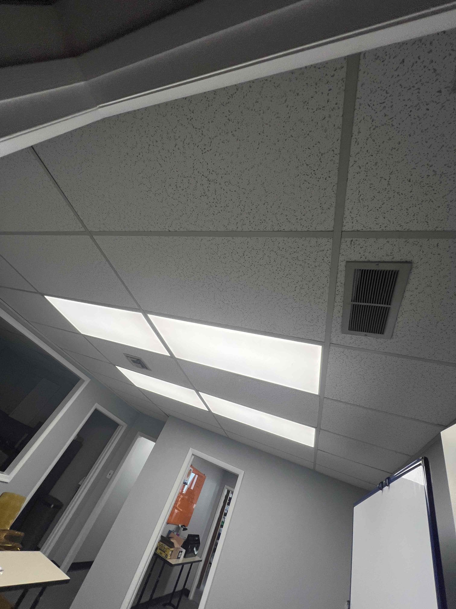 Scope of Job:
Install 2 gas furances, 2 air handlers with 2 "outdoor" heat pumps, and 1 mini split head with 1 "outdoor" unit in warehouse for training purposes.
Gas Line:
Existing gas line in warehouse transitions from 1" to 3/4" to 1/2" to existing gas furnace suspended in ceiling. We will add a 3/4" gas cock right after 1" transitions to 3/4" pipe for isolation. Add a tee to go to ceiling furnace and to add a pipe going about 4ft down from which we will add 4x tees to supply the 2 gas furnaces and 2 future gas equipment.
Flue Venting:
Gas furnaces are 90% efficiency and will need 2" PVC for intake and exhaust. May need to drill a hole through the concrete wall to exhaust.
Power Supply:
120v application can be supplied through existing outlets behind equipment. 14 gauge wiring and plug will be installed on gas furnaces. 240v application might be a challenge as there is room on the breaker for 1 double pole breaker. We can run wire from breaker through floor from 1st floor and run  Scope of Job:
Install 2 gas furances, 2 air handlers with 2 "outdoor" heat pumps, and 1 mini split head with 1 "outdoor" unit in warehouse for training purposes.
Gas Line:
Existing gas line in warehouse transitions from 1" to 3/4" to 1/2" to existing gas furnace suspended in ceiling. We will add a 3/4" gas cock right after 1" transitions to 3/4" pipe for isolation. Add a tee to go to ceiling furnace and to add a pipe going about 4ft down from which we will add 4x tees to supply the 2 gas furnaces and 2 future gas equipment.
Flue Venting:
Gas furnaces are 90% efficiency and will need 2" PVC for intake and exhaust. May need to drill a hole through the concrete wall to exhaust.
Power Supply:
120v application can be supplied through existing outlets behind equipment. 14 gauge wiring and plug will be installed on gas furnaces. 240v application might be a challenge as there is room on the breaker for 1 double pole breaker. We can run wire from breaker through floor from 1st floor and run