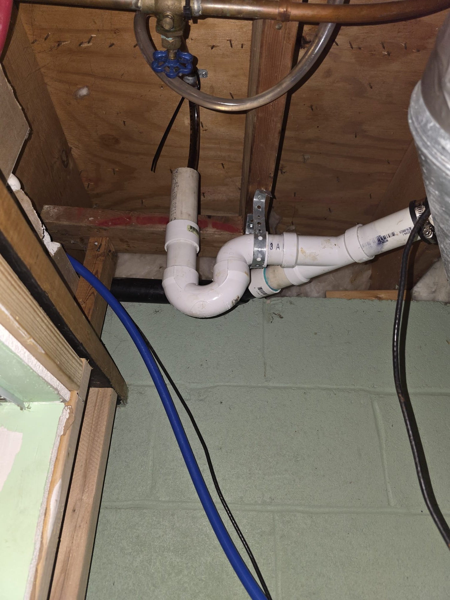 Removed coupling and brushed out a little more debris from the y in the pipe.  Attempted to run the softener in regen mode and found draining now but style of air gap and due to height was causing splashing.  Put tubing into standpipe for now as a temporary measure.  Tested through regeneratiin.  Need to come back with other style air gap that is a 90 configuration.  Installing new air gap should not take more than 20 minutes.   

Recommend auto water shutoff valve and leak sensor under drain trap to shut off water supply if the drain ever gets blocked in the future.  Estimate provided.