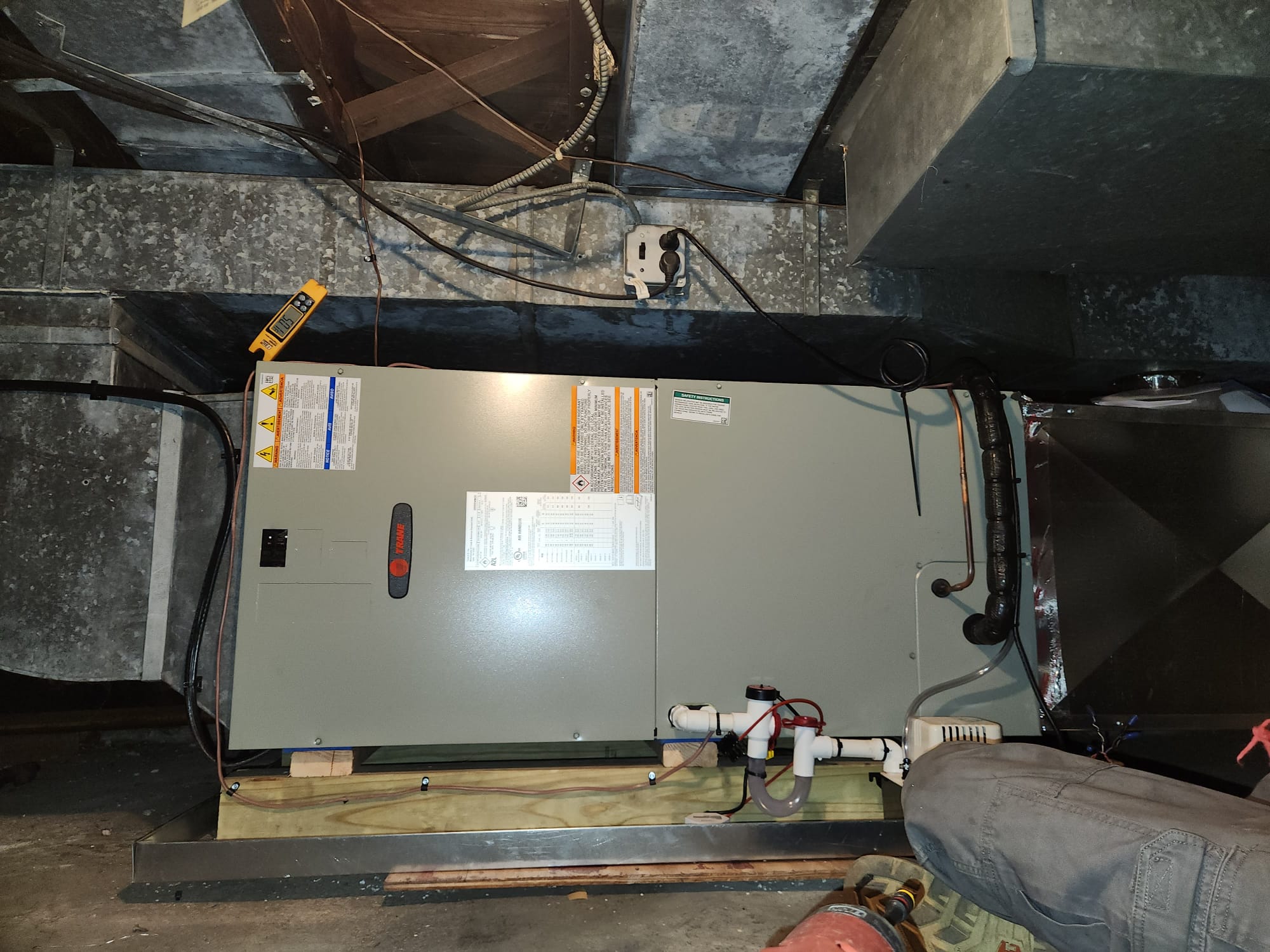 Set new unit in new auxiliary drain pan. Adapted to Supply and return ducts. Ran new high voltage wires from breaker panel to new unit. Ran new copper lineset from indoor to outdoor unit. Ran new condensate drain with ez trap to new condensate pump. Made all high and low voltage connections to unit. Wired all safeties in series to break 24v R call to thermostat. 

Set new unit on new pad and leveled. Hung new disconnect box with internal surge protector and sealed to wall. Piped in new lineset to unit. Brazed pressure tested evacuated and charged system. Made all high and low voltage connections to unit. Performed all test put procedures cleaned all work areas and reviewed installation with homeowner.