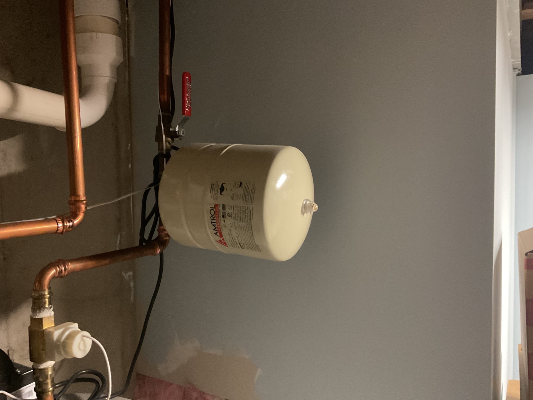 Found failed expansion tank, drained down tank enough to replace leaking expansion tank. Replaced with st12 expansion tank and checked for leaks, no leaks present. Water heater is working properly at time of service. Also strapped in place. 