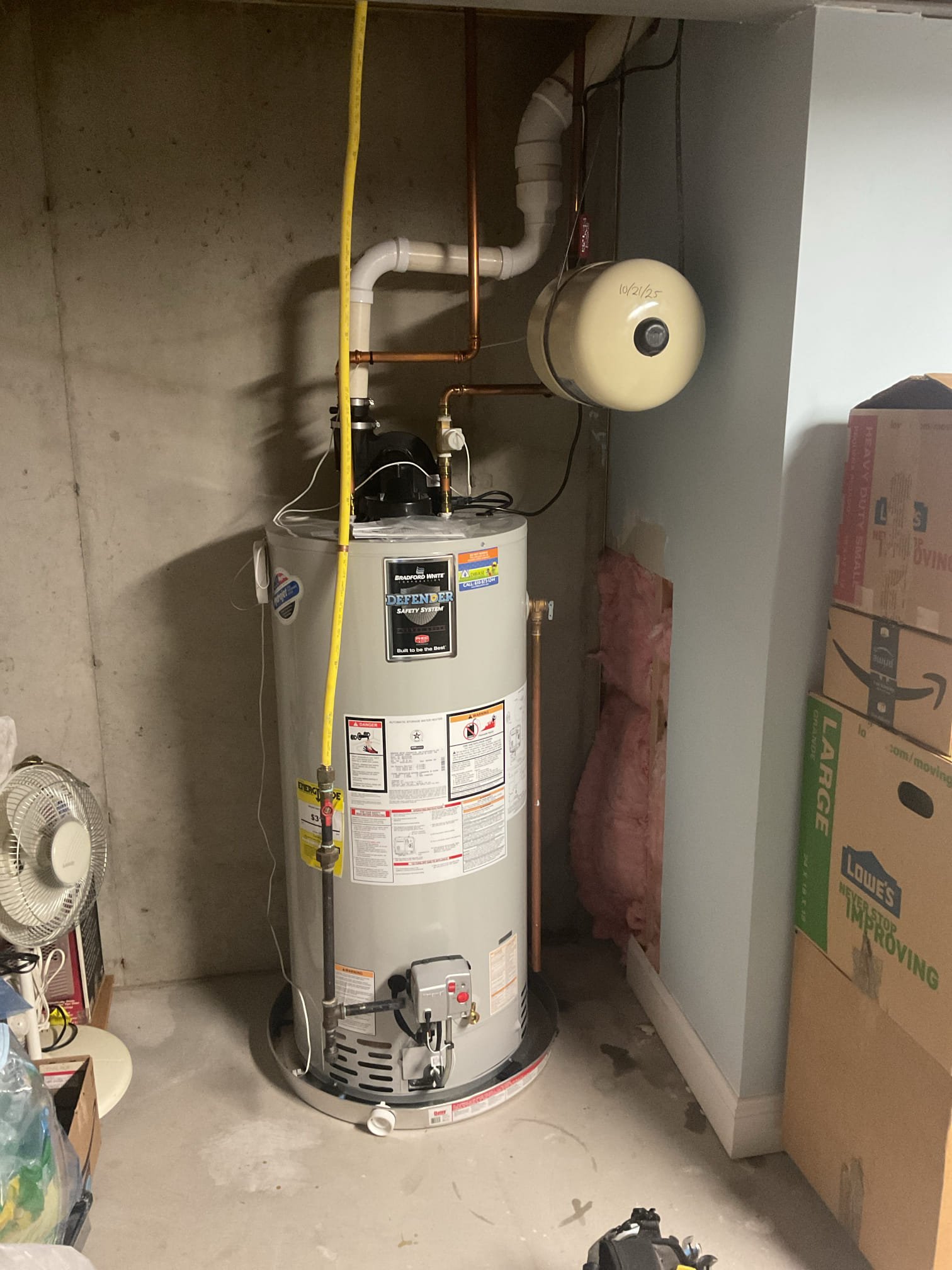 Found failed expansion tank, drained down tank enough to replace leaking expansion tank. Replaced with st12 expansion tank and checked for leaks, no leaks present. Water heater is working properly at time of service. Also strapped in place. 