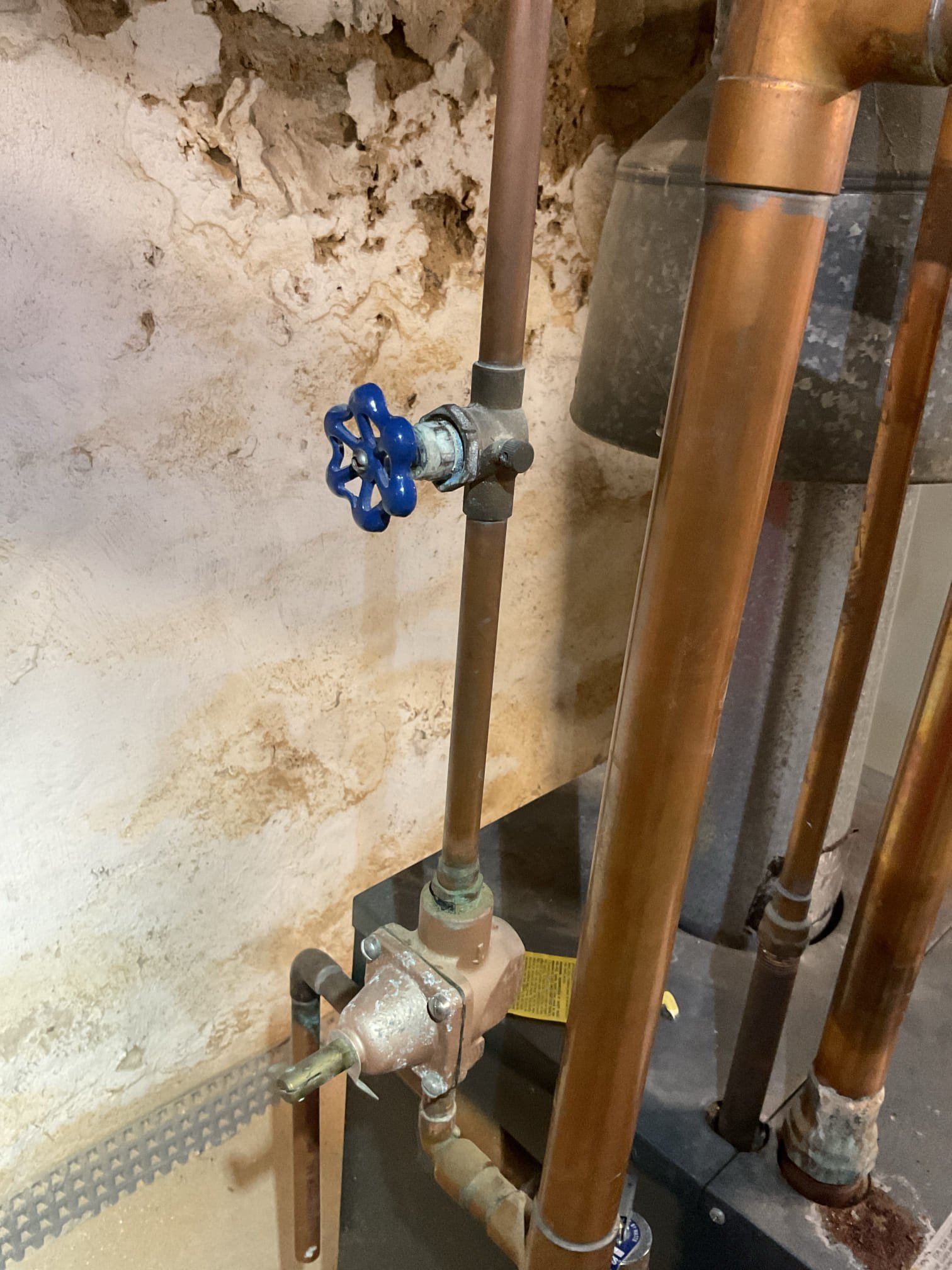 Relieved pressure from boiler.
Unthreaded unions on problem radiator both sides.
Unfortunately the radiator had 8 gallons of water still in it. Gradually drained radiator into small containers until nearly empty. 
Removed old valve.
Installed new valve with thread tape and pipe dope.
Reinstalled boiler in place and tightened unions.
Pressurized boiler. Bled all radiators and tested.

Couldn’t stay long enough to wait for problem radiator to get to temp but it is bled of air.
I told her to keep the thermostat on to allow boiler to come back to temp.
Left estimate to install new 1/2” boiler feed valve. Current valve is a gate valve with slight leak at packing nut.

She paid balance today. 

Todays problem radiator may be controlled by the thermostat labeled “apartment”