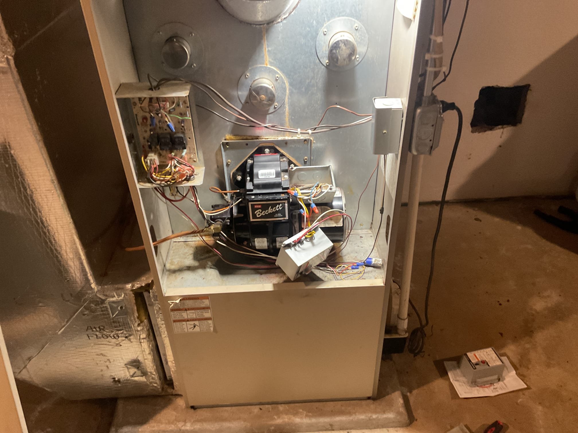 Fully assessed no heating situation. Went downstairs and hit reset button on new primary control ( installed by homeowner). Checked over wiring and everything was wired correctly and connections were tight. Hit reset button once and everything fired up and started working. Due to system being 25 years old would recommend replacing oil furnace. Performed combustion test, furnace is working at time of service. No guarantee on control since not replaced by dibiase. Cycled furnace several times after a while found that the ignition transformer quit sparking. Provided estimate to replace failing ignition transformer. Omar may replace himself. 
