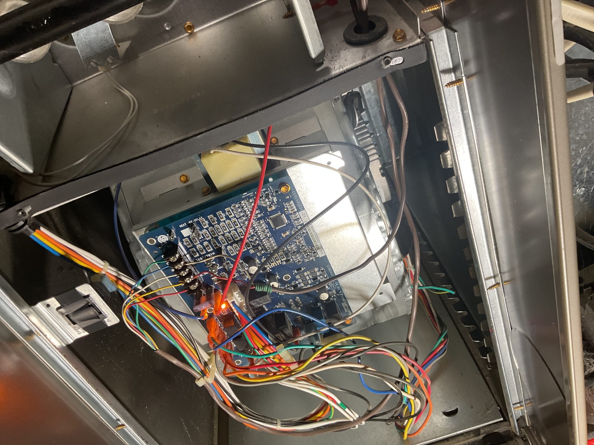 Fully assessed no heating situation. Found furnace locked out on code 33 high limit code. Found x13 carrier blower motor has failed. Called distributor and verified it is still under warranty. Collected 50% and ordered motor. Explained to customer that more than likely the motor failed to a power surge. Offered surge protection. Customer has no heat at this time. 

11/7/25
Barry

Installed OEM blower motor under Carrier parts only warranty.
Wired speed taps as before.
Tested system operations
Observed and verified all steps in the trial for ignition process. 

Combustion test: Pass

The humidifier on supply plenum is non operational and outdated. Provided estimate for new humidifier bypass humidifier with manual control. 
Also provided estimate to remove and patch old humidifier

System operating well at this time.

 