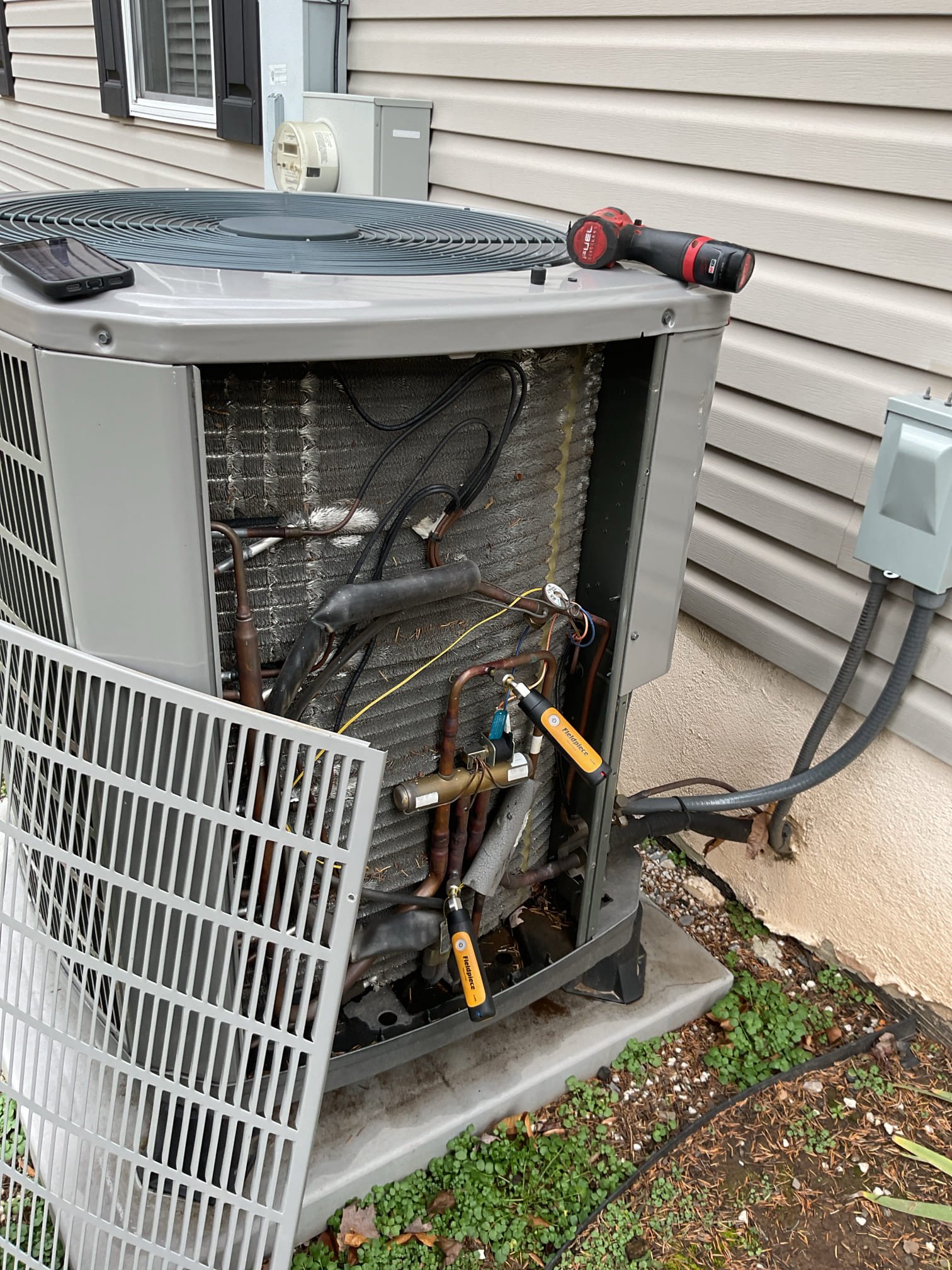 Equipment is heat pump with electric backup.
Thermostat was displaying “Heat On” when I arrived.
Checked low voltage wiring connections. 0 volts between 
 “Y” (Compressor) and “C” common. There was no demand for comprsssor. Checked wiring connections including the “Y” conductor in thermostat subbase. Found to be good.

Went through installer setup and found that the hard wire temperature sensor was selected off and thermostat was configured for conventional heat as opposed to heat pump.  Reconfigured thermostat. Aux heat lockout 35°F. Heat pump lockout 15°.

Afterwards tested system pressures and temperature rise are good.

They did have a power outage recently. It is difficult to say what caused the thermostat to reconfigure for conventional heat. I left email estimate for WiFi Thermostat so homeowner has options if it is determined that the thermostat itself is the problem. 

They may go forward with plan in the summer.

I made the mistake of telling them $99 on Sunday for diagnostic