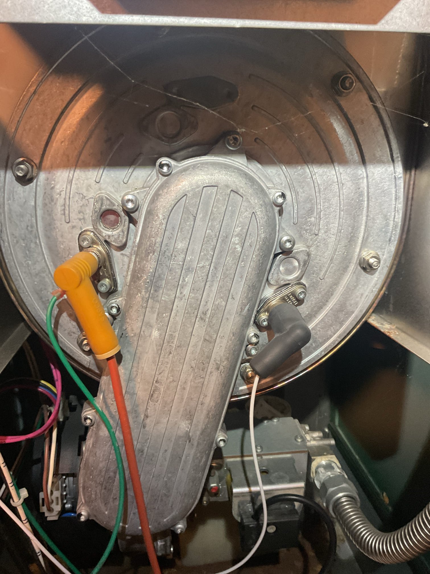 Completed heat tune up for high efficiency natural gas boiler.
Inspected heat exchanger and burners: also clean. Cleaned burner compartment. Vacuumed heat exchanger. 
Inspected pilot assembly and cleaned with fine steel wool 
Inspected hyrdronic components: air scoop, feed valves, expansion tank, circulator. 
Checked wiring controls and components. The display is glitching, the light goes in and out, limited use of control. Although boiler is operating the display is acting up. We will provide estimate to replace boiler display. 
 A surge protector can be installed at 120V feed (relay board) would protect controls.

Combustion and draft tests: Pass

System operating well at this time. 