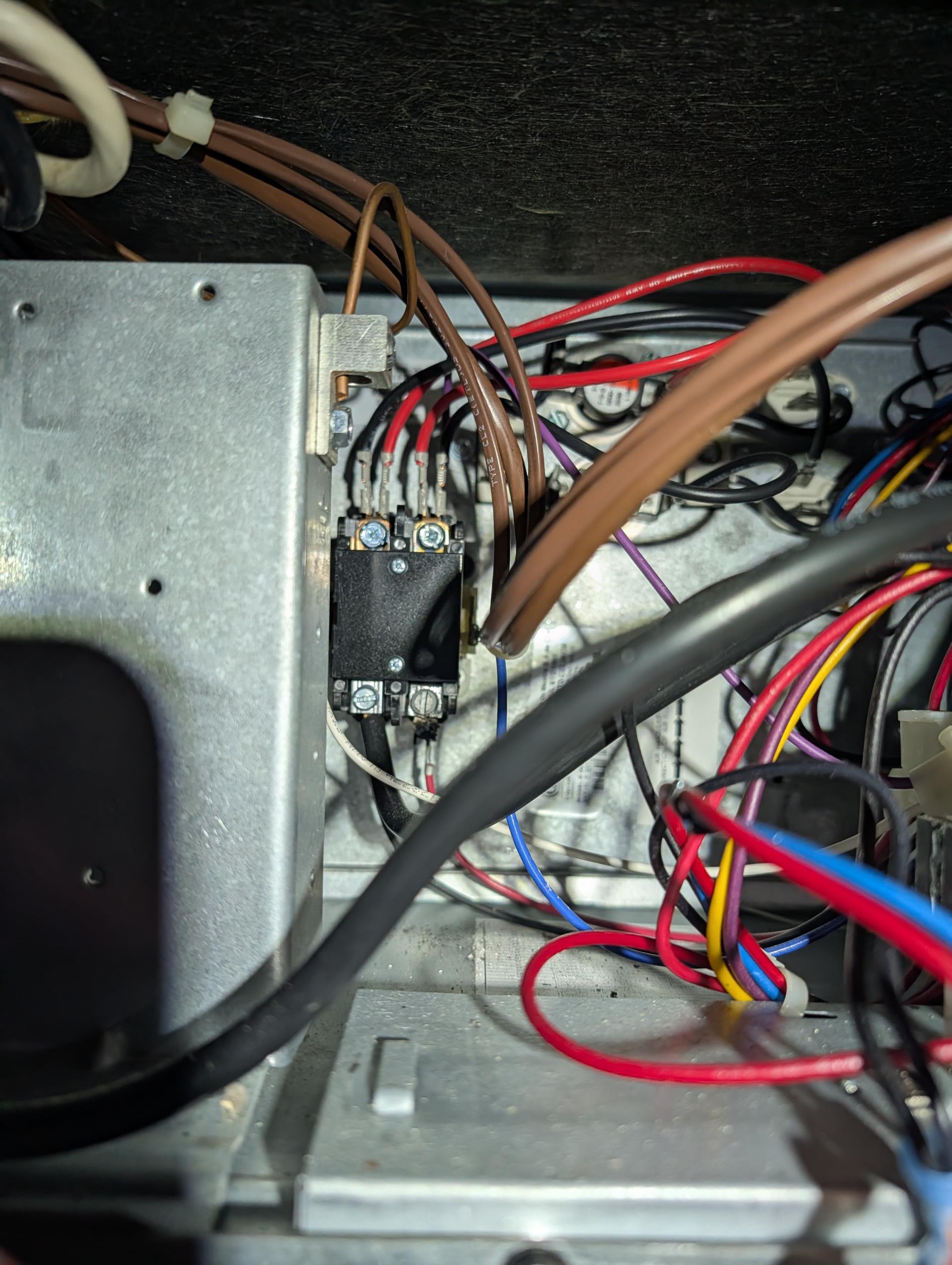 Found 0 Volts at secondary (24V) side of both contactors.
Found burnt off and detached lead wire to the electric heat contactor.
The terminal of contactor in bad shape.
Offered to replace contactor under parts warranty and repair wiring connection.
I stripped back the wire to a clean point and installed in new contactor.
Installed new contactor under parts warranty.
Checked over all wiring connections and outdoor control. 

I explained to her that it is the correct size wire but it was either slightly overtorqued or under torqued on the manufacturer floor and overtime that point of contact overheated and eventually caused the wire to fray and detach. This wiring is all internal/ manufacturer. NOT a field supplied wire. 

Also offered to install blower motor surge protector. She agreed. Completed work today.

Replaced Aprilaire 313 filter provided by homeowner.recommend replacing every 6 months. 

Tested system including electric heat amps. 40A Good.

System operating well at this time.