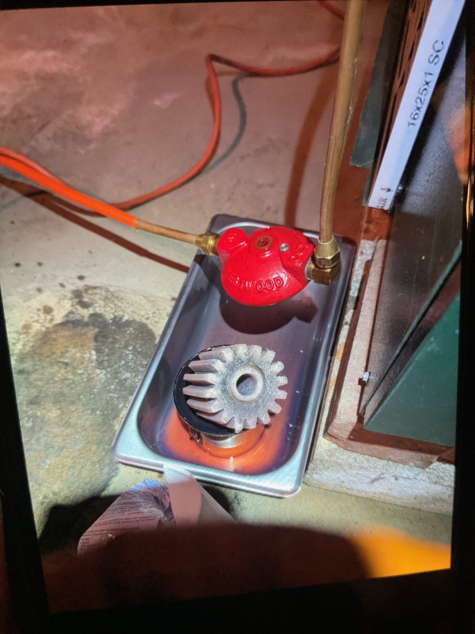 Completed heat tune up for oil furnace.

Replaced 16x25x1 air filter. 
Cleaned heat exchanger and inspected flue piping and chimney. Light coating of soot. There is no chimney liner. A liner is preferred. Chimney company would run liner. 
Open return on basement. No ducted return with natural draft appliance. This is considered risky and unsafe. Return air will influence combustion and combustion byproducts can make their way into air strea. 
Replaced oil filter, strainer with gasket and nozzle.
Inspected electrode condition and alignment, transformer, cad cell eye, and air bands for debris. 
Inspected wiring, controls, electric motors and components including fan speeds. A surge protector can be installed on blower motor. Provided email estimate.
Bled oil line and tested system

Combustion, smoke and draft tests: Pass

Oil tank is 40+ years old. A company secondary to his oil delivery comp h (Had 1 delivery in February) assessed the tank and deemed it not fit for use. He painted the t