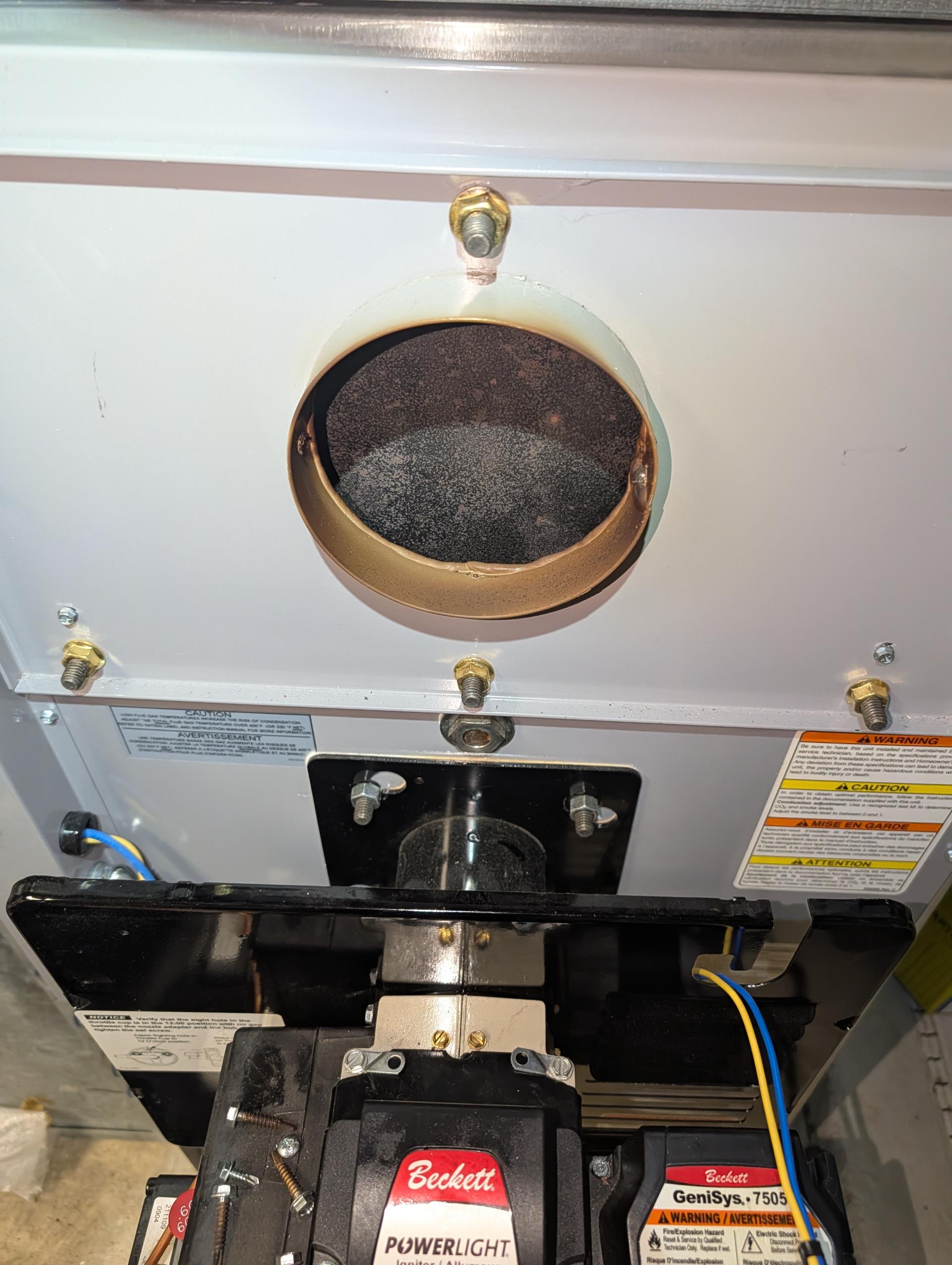 Found .60 60A nozzle slightly lose and clogged. Electrodes were also slightly misaligned.
After putting new nozzle and making sure it’s tight. I bled lines. 

Offered to go through maintenance procedures as part of plan membership.
They agreed.
Completed heat tune up for Carrier oil furnace.

20x24x1 filter ok
Cleaned heat exchanger and inspected flue piping and chimney. 
Replaced oil filter (RF1), strainer with gasket and (.60 60A) nozzle. Wiped out bottom of filter canister, decent amount of sludge?. The nozzle listed for  this burner on furnace nameplate is .70 60A
Inspected electrode condition and alignment, transformer, cad cell eye, and air bands for debris. 
Inspected wiring, controls, electric motors and components including fan speeds. 
Bled oil line and tested system.

Combustion, smoke and draft tests: Pass initially

Oil tank is old, beginning to break down internally. Recommend replacing oil tank and fill and vent piping. 

Oil burner has experiencing delayed ignition and 