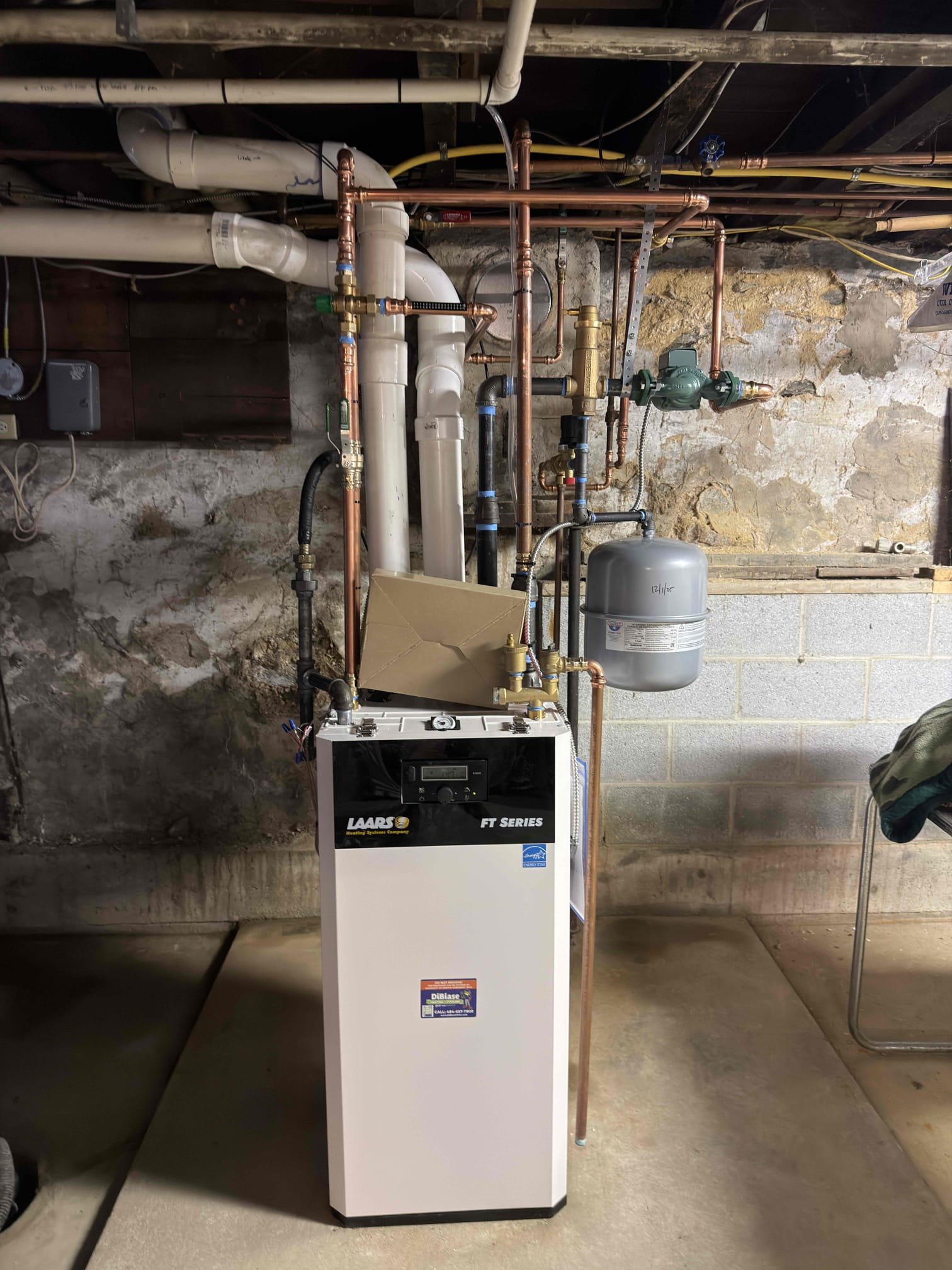 Installed new larrs combination boiler. Adapted vent piping and gas line. Adapted boiler supply piping and installed new spiral vent, circ pump and expansion tank. Adapted boiler return piping and installed new water feeder. Adapted high voltage and installed new outlet for boiler. Pipped in domestic water and installed new mixing valve. Reused existing thermostat and wired in low volt with outdoor sensor. Cleaned up work area and tested out equipment.
