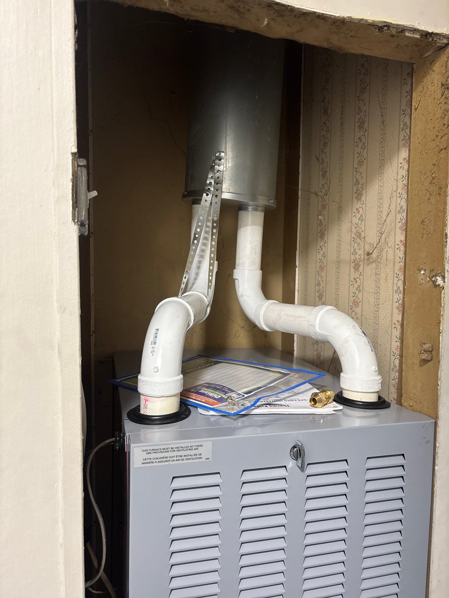 Installed new plywood under furnace. Floor was rotted out.
Installed new thermopride downflow furnace. Made new terminations on roof and ran pvc for venting. Ran new 1/2” gas line from outside to indoor unit. Installed a T4 thermostat. Converted to propane. Installed AG3000 surge protector. Cleaned work area and tested all operations. 

Return visit to do test out and level unit.
Used ISO pad and screwed against wall to keep level

checked incoming LP pressure / 12 inwc (leaked checked entire gas line)
Ran furnace and found blower wheel rubbing on housing, cut vents out and pulled blower to realign wheel. Re installed blower Tested in fan mode, first all clear reinstalled vents and fired off furnace

Set gas pressure to 10 inwc at manifold ran combustion test and logged temp rise. See pics on file. 
All operational upon departure set to 68 per client