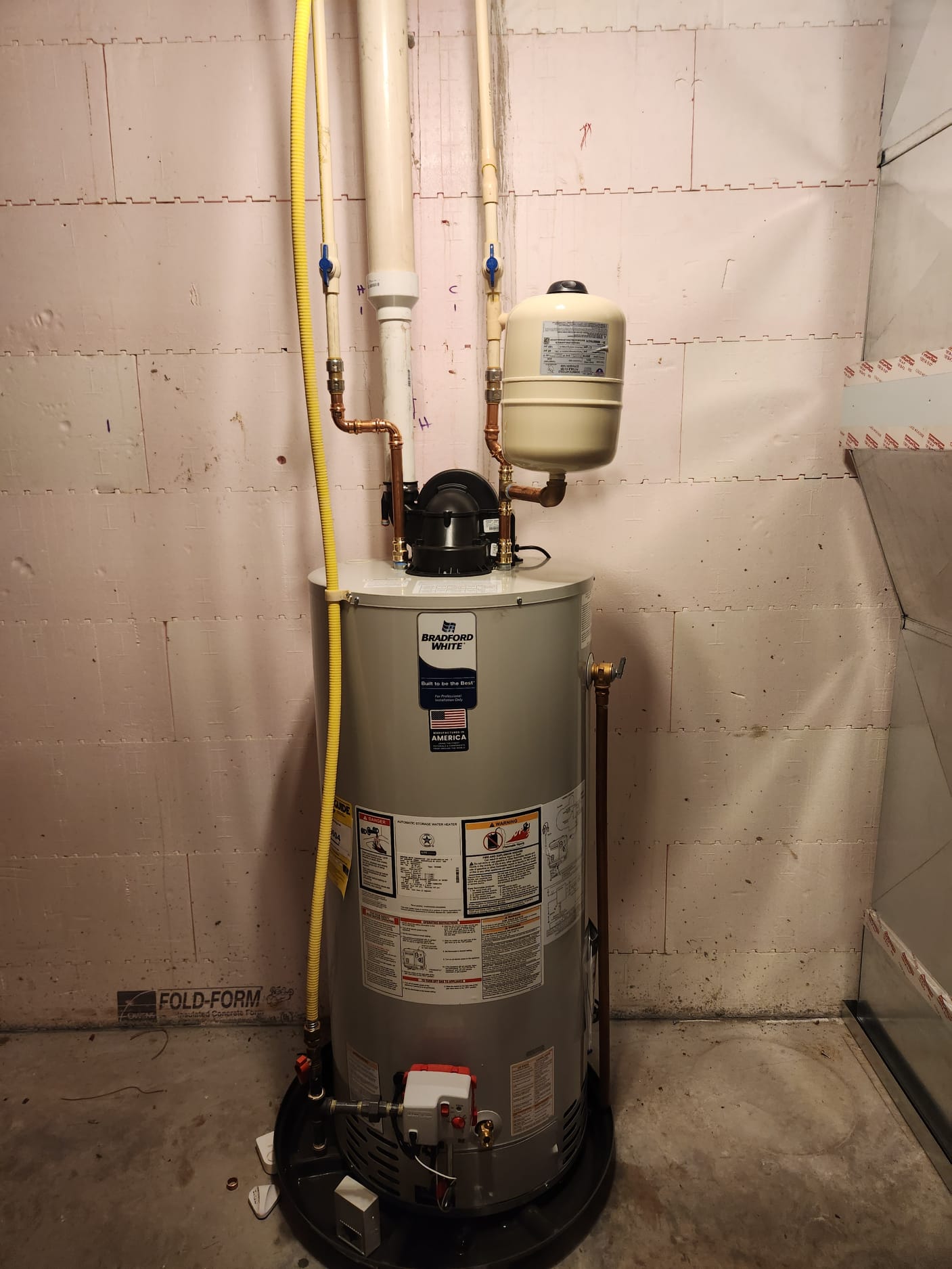 Drained existing water heater. Removed existing flue pipe and gas line. Set new 50 gallon water heater in new drain pan with water alarm. Piped in hot and cold side including new st5 expansion tank on cold side. Checked for leaks. Adapted to flue pipe. Adapted gas line and leak checked. Filled water heater and lit pilot. Ensured proper operation.