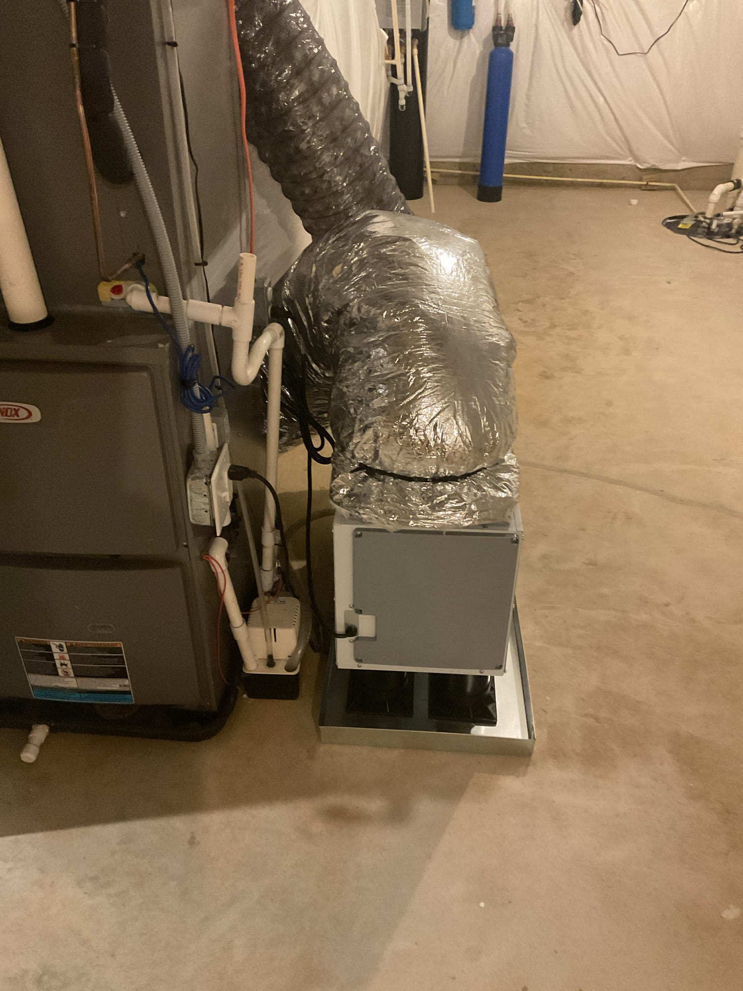 I arrive to the customers home to remove the round metal duct coming off of the dehumidifier, which would create the sound through the returns on the 1st floor. I removed all of the 10 inch round metal and ran r8 10 inch flex from the dehumidifier to the return. I secured each end with wire ties and tightened and secured with strapping if needed . I turned the dehumidifier back on to the system.  Customer said there’s no more noise very quiet. Customers very happy with the results. no charge under warranty. 