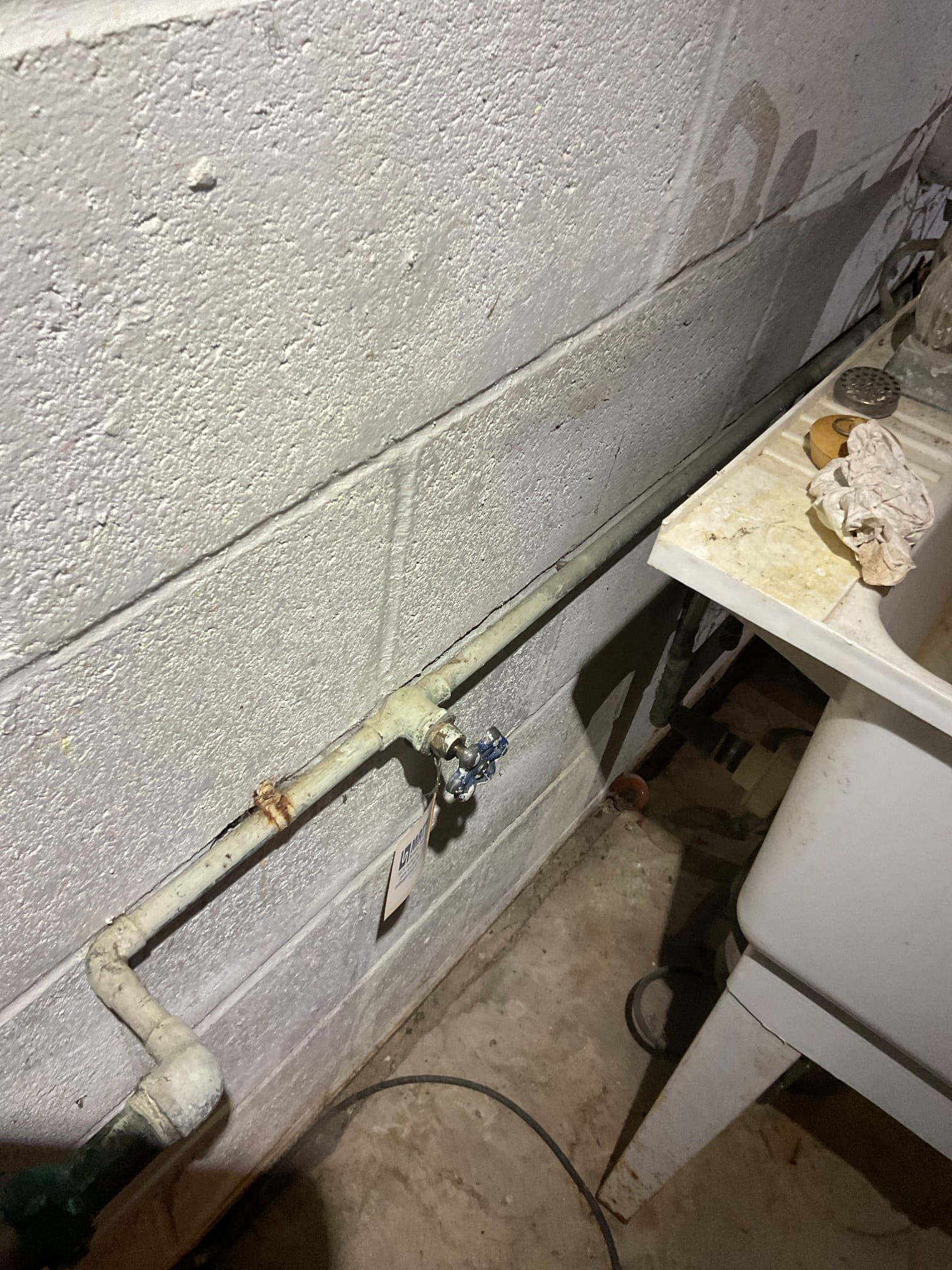 
 Found failed expansion tank. The temperature and pressure valve is dry and is no longer leaking
Leak has not gotten worse since Kim texted me last night. Which means it is likely the temperature and pressure valve burped as a result of failed expansion tank. However given age of tank a small tank leak could be present. There is also corrosion and water marks around lower element.

The house water pressure is just slightly high about 75-78 psi. which is on the high side of acceptable range. (45-75 psi). Provided estimate for pressure reducing valve. 

Provided estimates.
1. minimal repair: Replace expansion tank under 5-year parts only warranty.
2. Recommended repairs: Replace expansion tank+ corroded section of cold water piping+ install pressure reducing valve.
3. Ideal and comprehensive solution install new water heater AND pressure reducing valve.

Water heater is from 10/2015. Recommend replacing water heater and installing pressure reducing valve. 
I emailed original estimates o