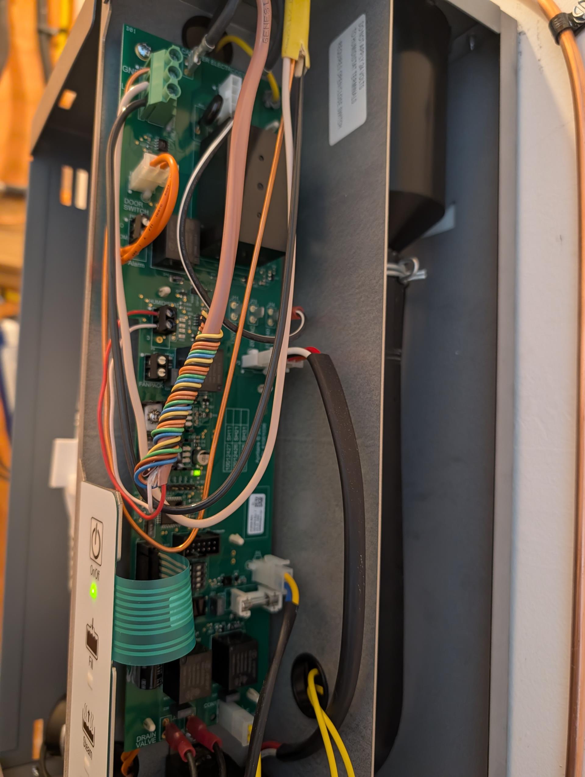 Humidistat is installed on the blower compartment.
Sensor is just to the right of the flex duct.
Humidistat is Reading 52% RH.

My humidity probe is reading 32% in the blower compartment

I tried making the hole for sensor a tad bit bigger and reinstalling, but humidity reading is still high.

We will come back with replacement humidistat. 

They are going away soon. Will have to be scheduled for after Christmas holiday. 
In the meantime I mounted humidistat in the mechanical room and wired. 
The mechanical room is on same floor as rooms they are trying to humidify. 
Humidifier working ok with humidistat mounted in mechanical room for now. Set to 5 

Told him to keep an eye on the ductwork in the attic as we had water in ducts before. 

Informed our warehouse to order part. 