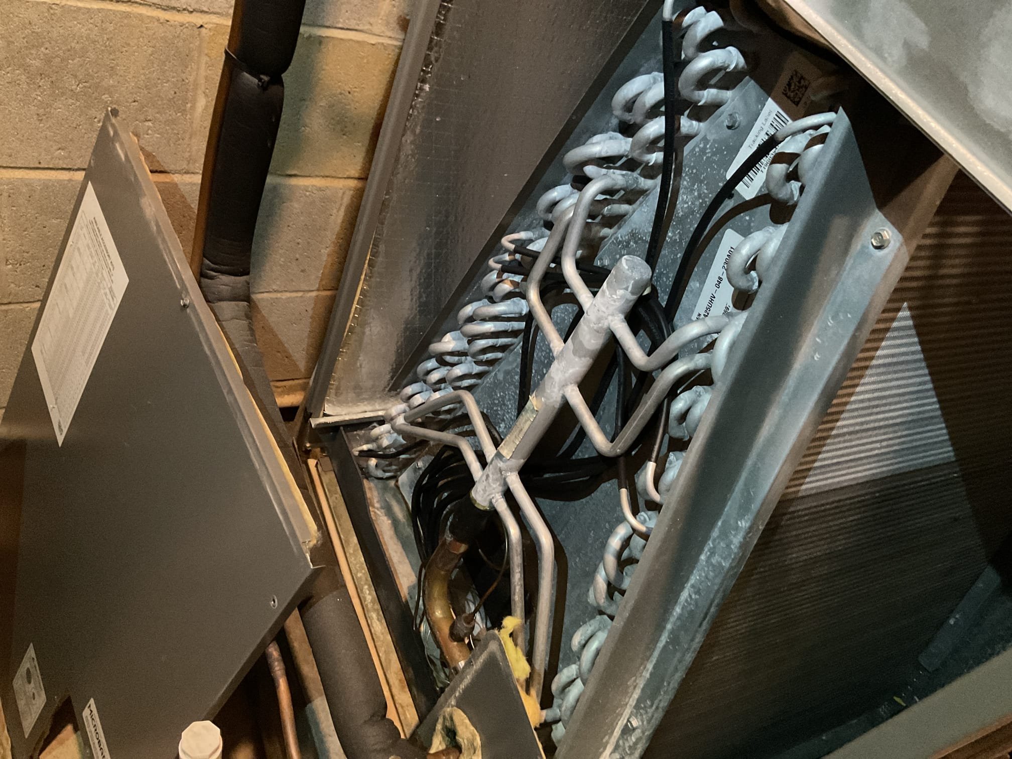 Fully assessed no heating situation on Lennox heat pump with hot water coil heated by system 2000 gas gun boiler. Found this heat pump system heats the master bedroom. Found cold air blowing out the vents and system was calling for heat pump. Found 2021 Lennox heat pump locked out on low pressure. Put gauges on the system and found it to be completely flat on charge. Gave her a price to do a nitrogen leak search on system but also told her to check in with installing contractor for any warranty with them. Switched thermostat to aux and master bedroom is now heating with hot water coil. Did not see any oil at evaporator coil. Outside unit is covered in ice and snow not a good time to do a leak search. System is running on back up heat.  Other company on their service record replaced txv valves several times. 