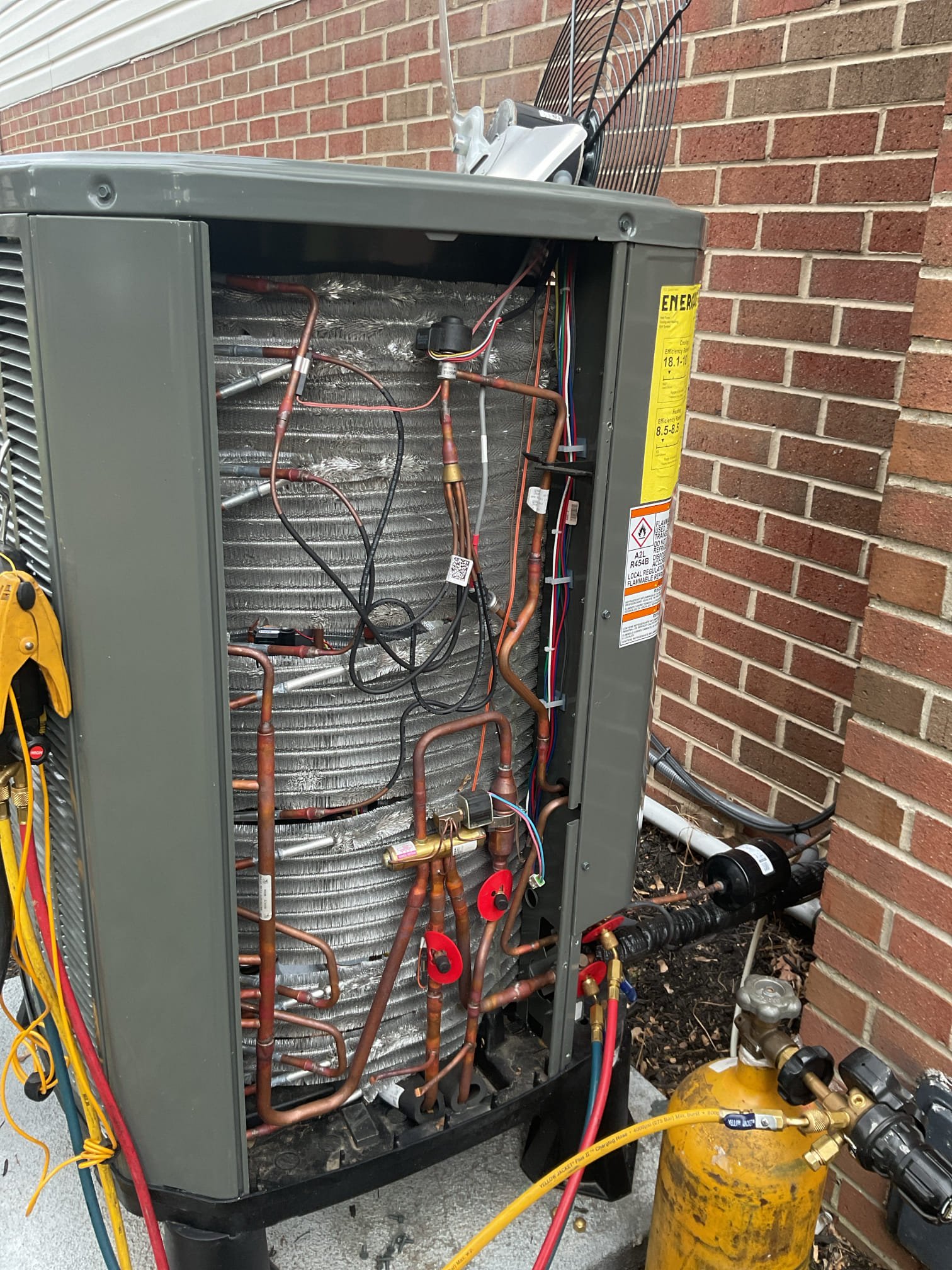 Found blown blower motor surge protector.
Replaced today.
The power monitor protected the outdoor unit circuit. 
After starting system got error codes for low suction pressure.
The earliest incident of low pressure error was on NOV 27.;
System is at 45 psi standing pressure on high side port. 0 psi on true suction. 
I pressurized system with nitrogen to 250 psi. There is a micro bubble (very small)  leak on a joint at liquid line near filter drier. 
Left disconnect OFF at outdoor unit. Please leave it off. 
We will schedule return for repair ASAP. 

System will run on emergency heat for now. 

I charged for surge protector only. 