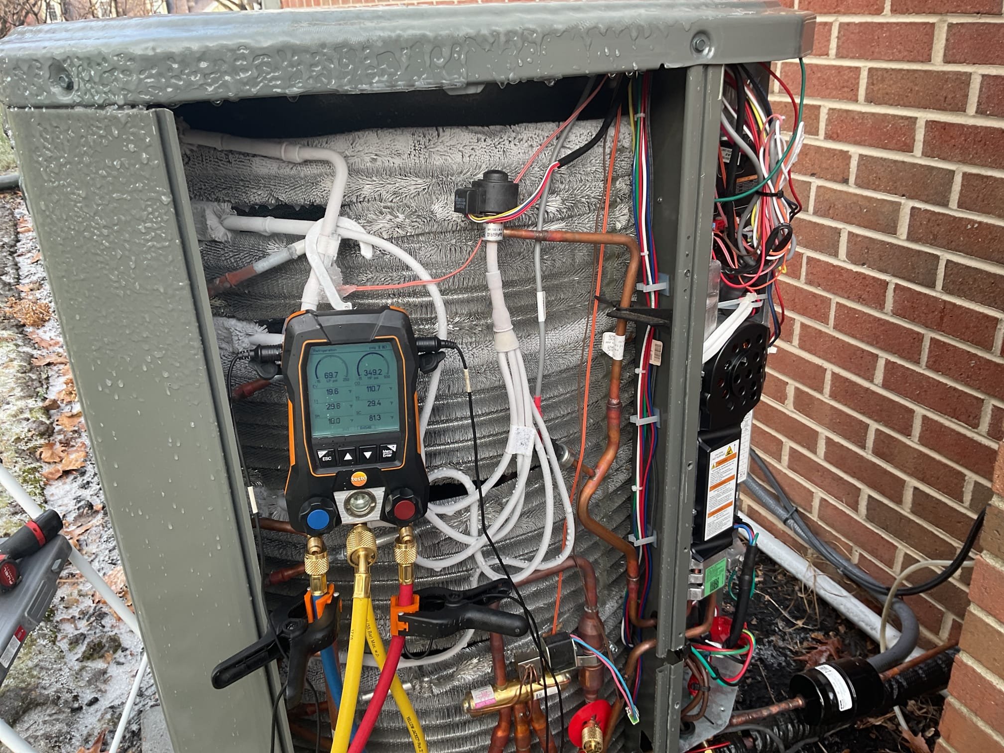 Fully assessed no heating situation. Found heat pump running when I arrived. R454b refrigarant pressures were 354/45. System then went through defrost cycle. Refrigerant pressures were then 332/54. Found that the thermostat was set to 74 and only reaching 69 degrees. Found system is consistently locking out on dohm sensor. Checked resistance of dohm sensor it is a 10 k ohm sensor at 70 degrees. Sensor was reading about 8600 ohms. Found that as the system was running eev valve was consistently freezing on the one side. And when system was at 100 % suction pressure was only 45. Will go over all info with tech support. Also found that there were no software updates in app. Heat pump is working but not at 100% 