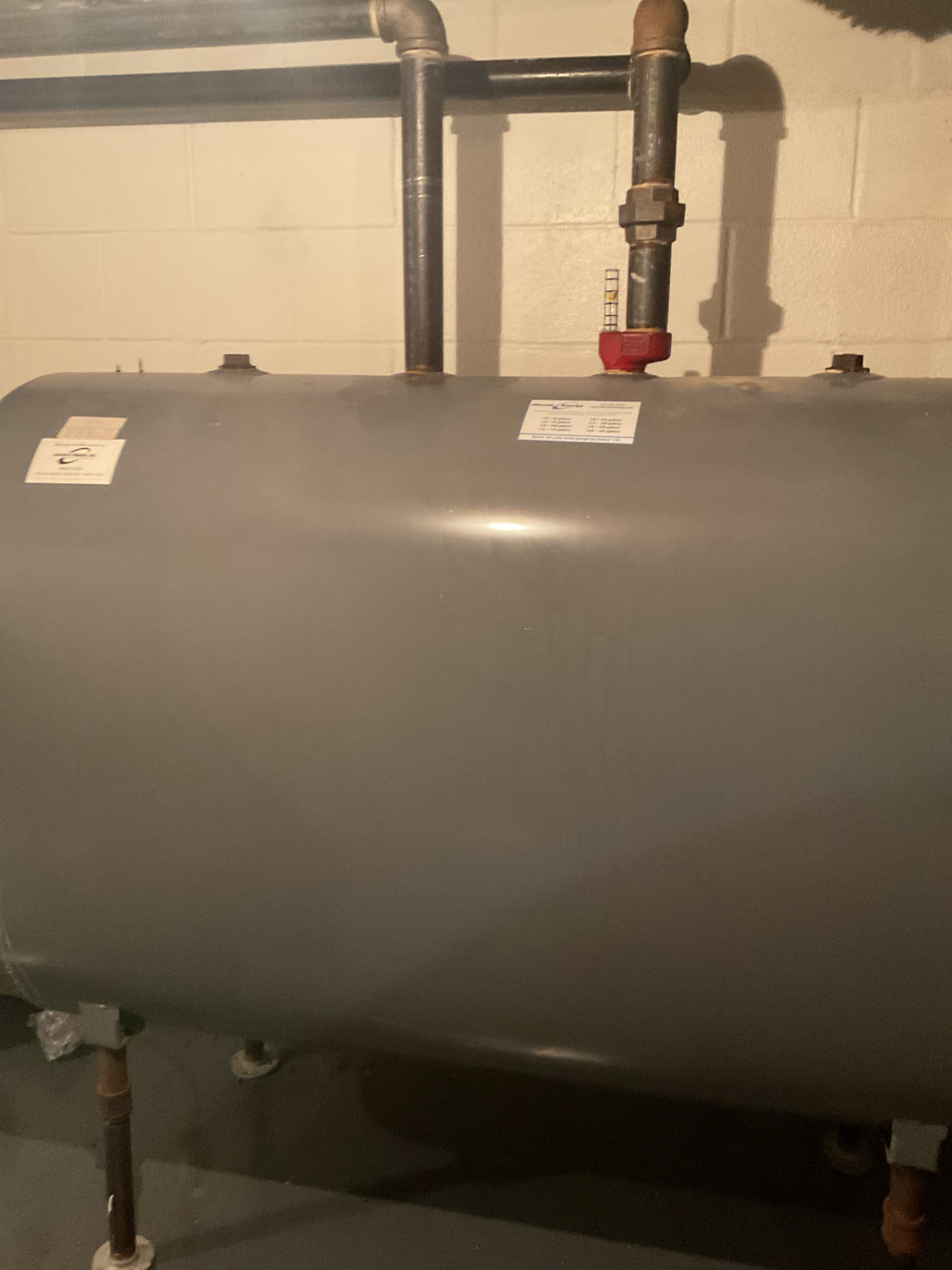 Performed precision oil tune up on 15 year old Weil McLain oil boiler. Checked all electrical connections and components. Replaced Rf1 oil filter, pump strainer, and 1.25 80b nozzle. Vacuumed soot from heat exchanger and smoke pipe and cleaned chimney base. Used furnace cement to seal around chimney. Found mixing valve is not working correctly on boiler this is causing the inconsistency in hot water.  Checked over aquastat settings. Performed combustion test. Oil boiler is working properly at time of service. 